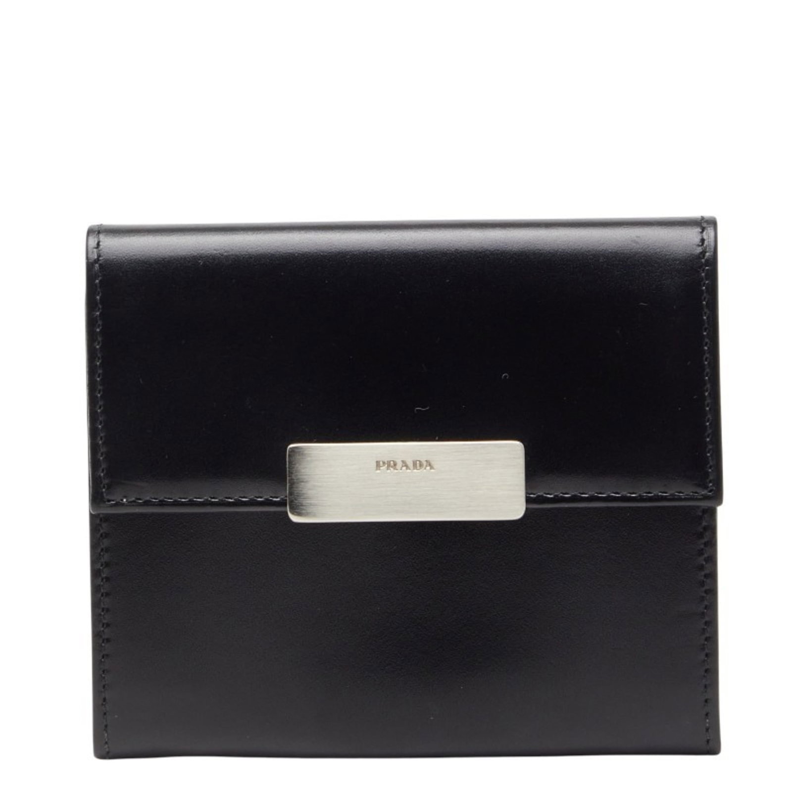 Prada Coin Purse/ Coin Case Leather: Prada Coin Purse/ Coin Case Leather The Prada Coin Purse/ Coin Case Leather is a sleek and sophisticated accessory, featuring black leather construction with visible traces of usage. Measuring 9cm x