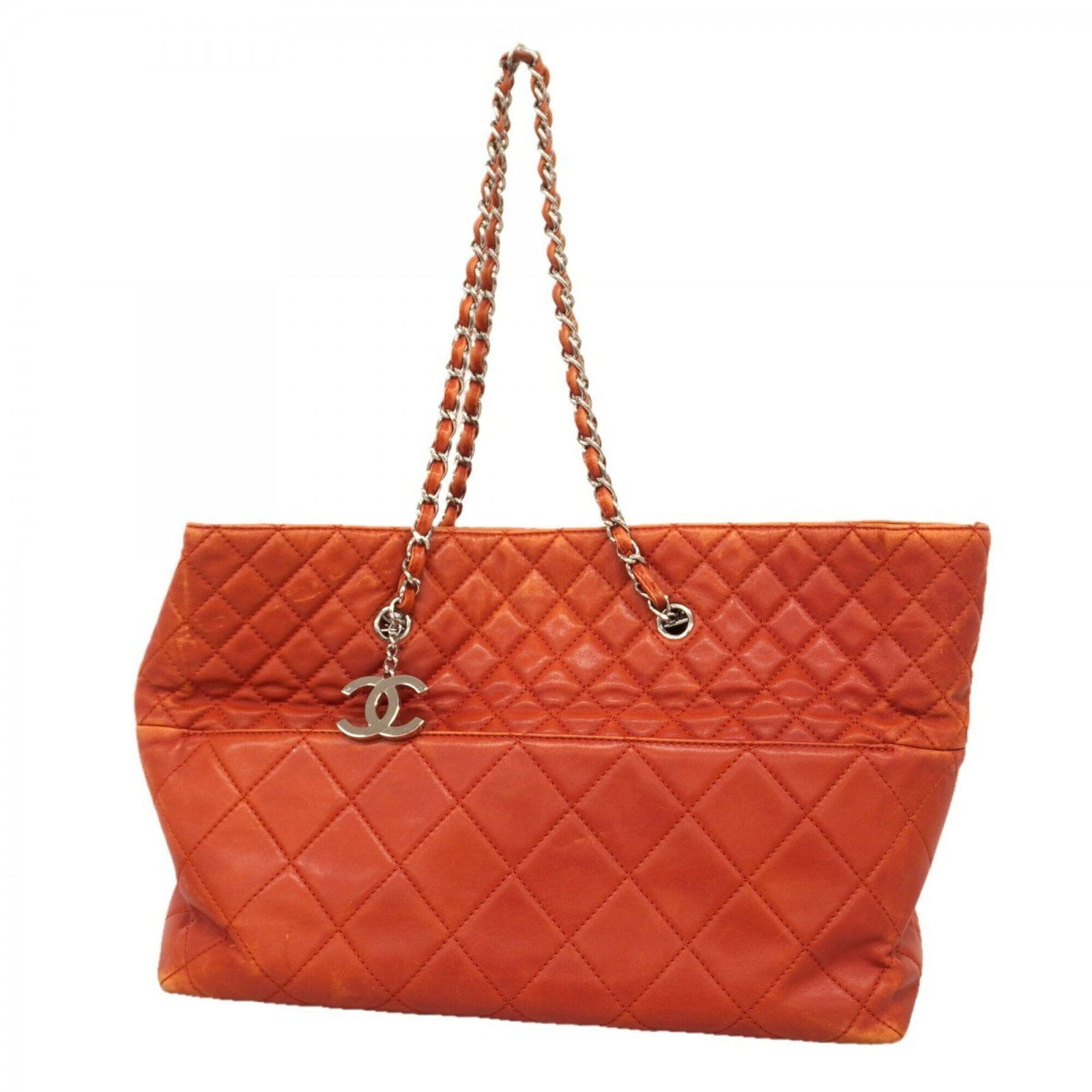 Chanel tote bag leather: Chanel tote bag leather This genuine Chanel lambskin tote bag features a striking red color and silver hardware, showcasing the timeless elegance of the iconic brand. With its classic design and high-