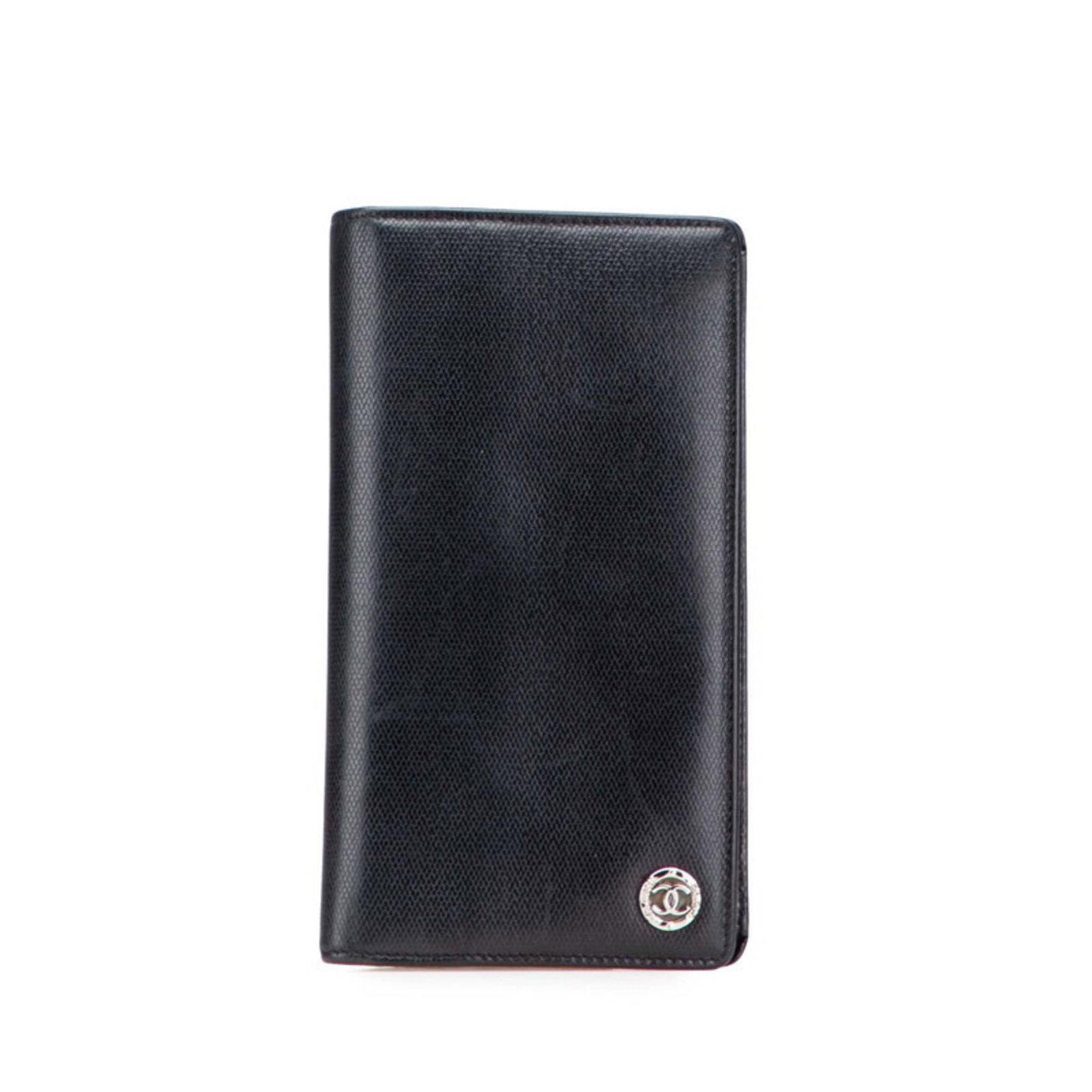 Chanel Long Wallet (Bi-Fold) Leather: Chanel Long Wallet (Bi-Fold) Leather This black leather Chanel bi-fold wallet features a classic design with a flap closure, measuring 18cm x 10cm x 2cm. The item has been used and shows traces of