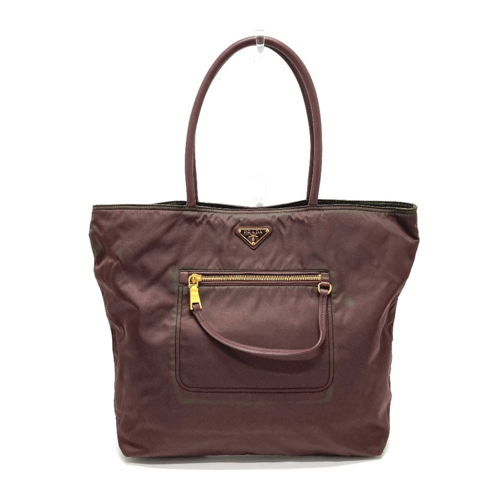 Leather Prada Tote Bag: Leather Prada Tote Bag Purple leather Prada tote bag with a classic design, featuring a sturdy handle and a timeless purple hue. Measuring 31.5cm x 30cm x 11.5cm in width, height, and depth,