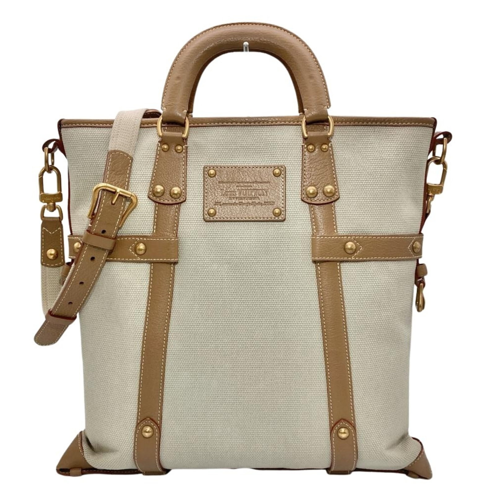 Canvas tote bag by Louis Vuitton: Canvas tote bag by Louis Vuitton Canvas tote bag by Louis Vuitton, featuring the iconic brand's signature beige canvas material. This used tote bag boasts a classic design with subtle scratches and