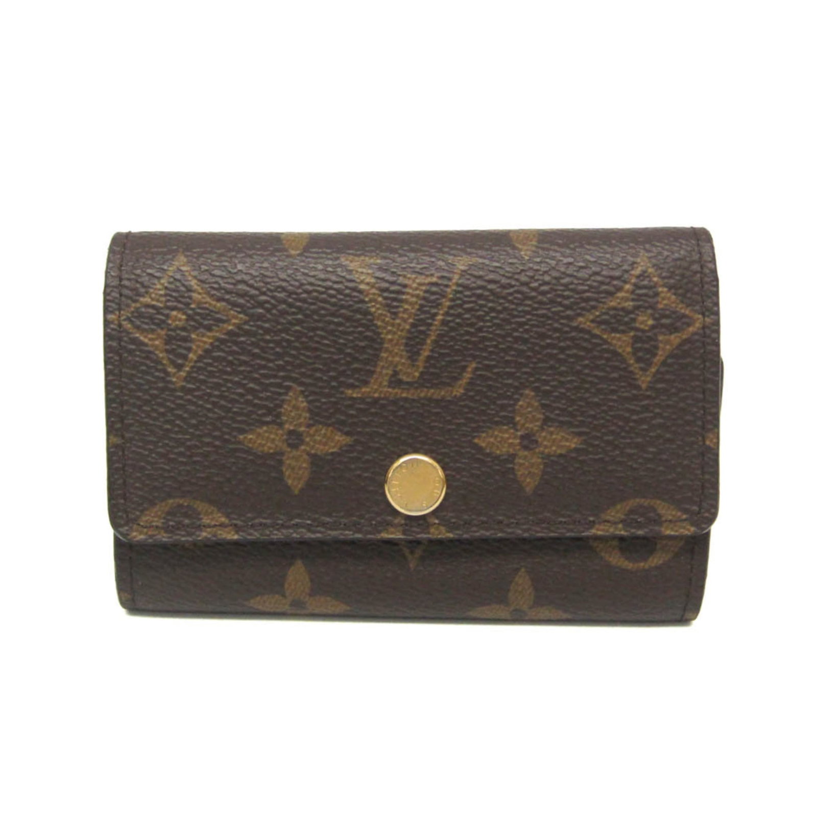 Keycase of Monogram Louis Vuitton: Keycase of Monogram Louis Vuitton Monogram Louis Vuitton Keycase in Brown. This used keycase features the iconic monogram pattern and has six hooks for storing keys. It shows some signs of usage with