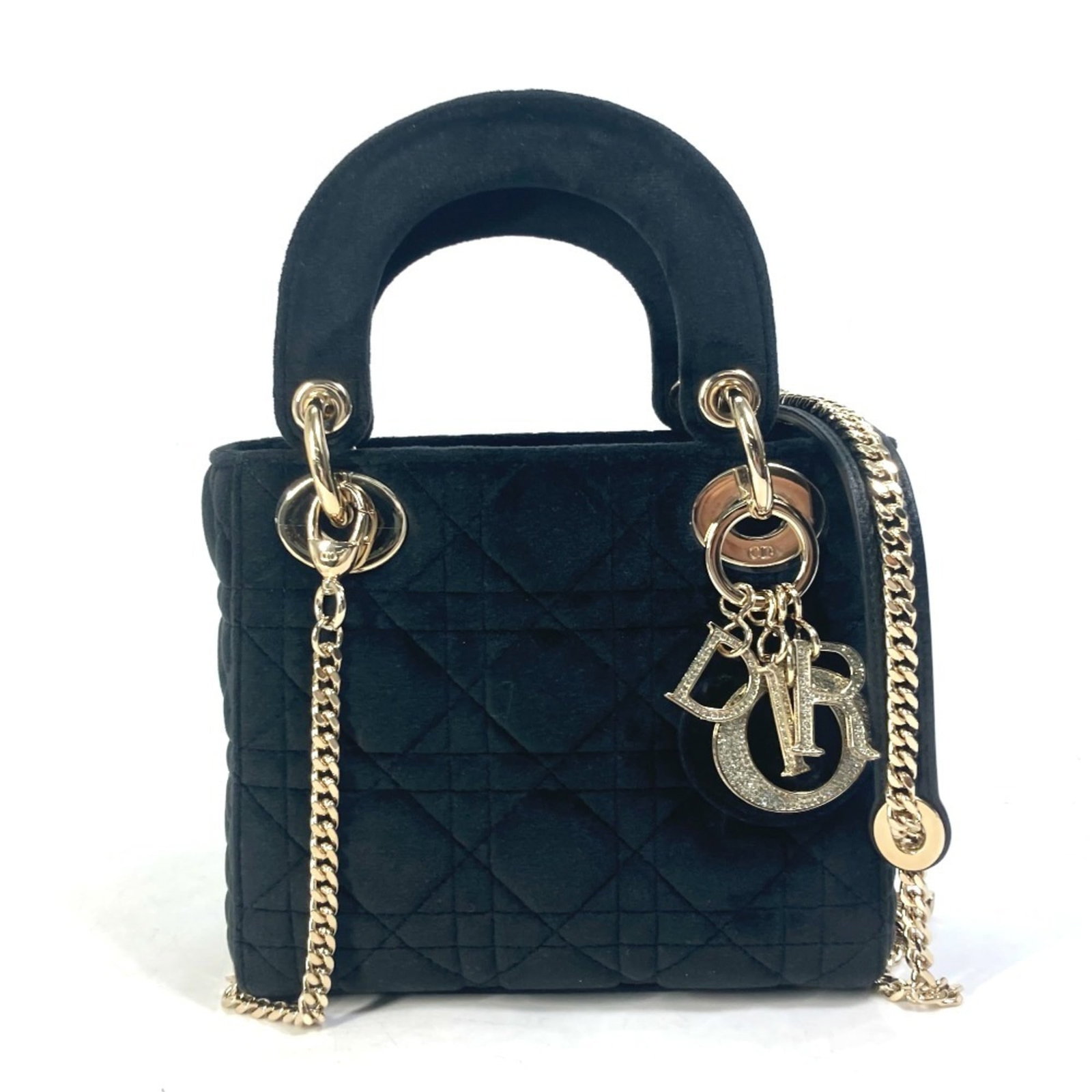 Handbag leather shoulder bag by Christian Dior: Handbag leather shoulder bag by Christian Dior Black velour leather shoulder bag by Christian Dior, featuring gold hardware and an open design with a zipper pocket. This luxurious handbag measures