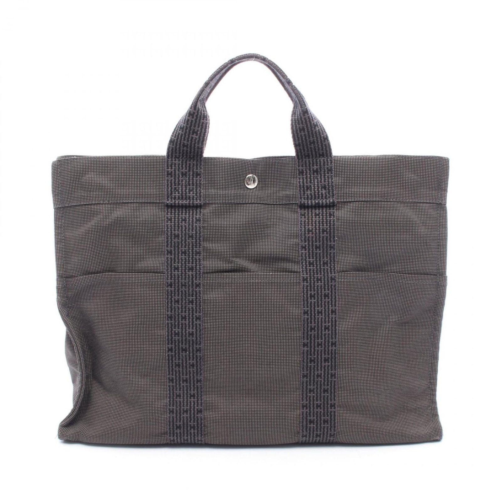 Hermes tote nylon canvas bag: Hermes tote nylon canvas bag Nylon canvas tote bag from Hermes in gray, featuring silver hardware and a classic design. With its durable construction and timeless style, this versatile bag is perfect 