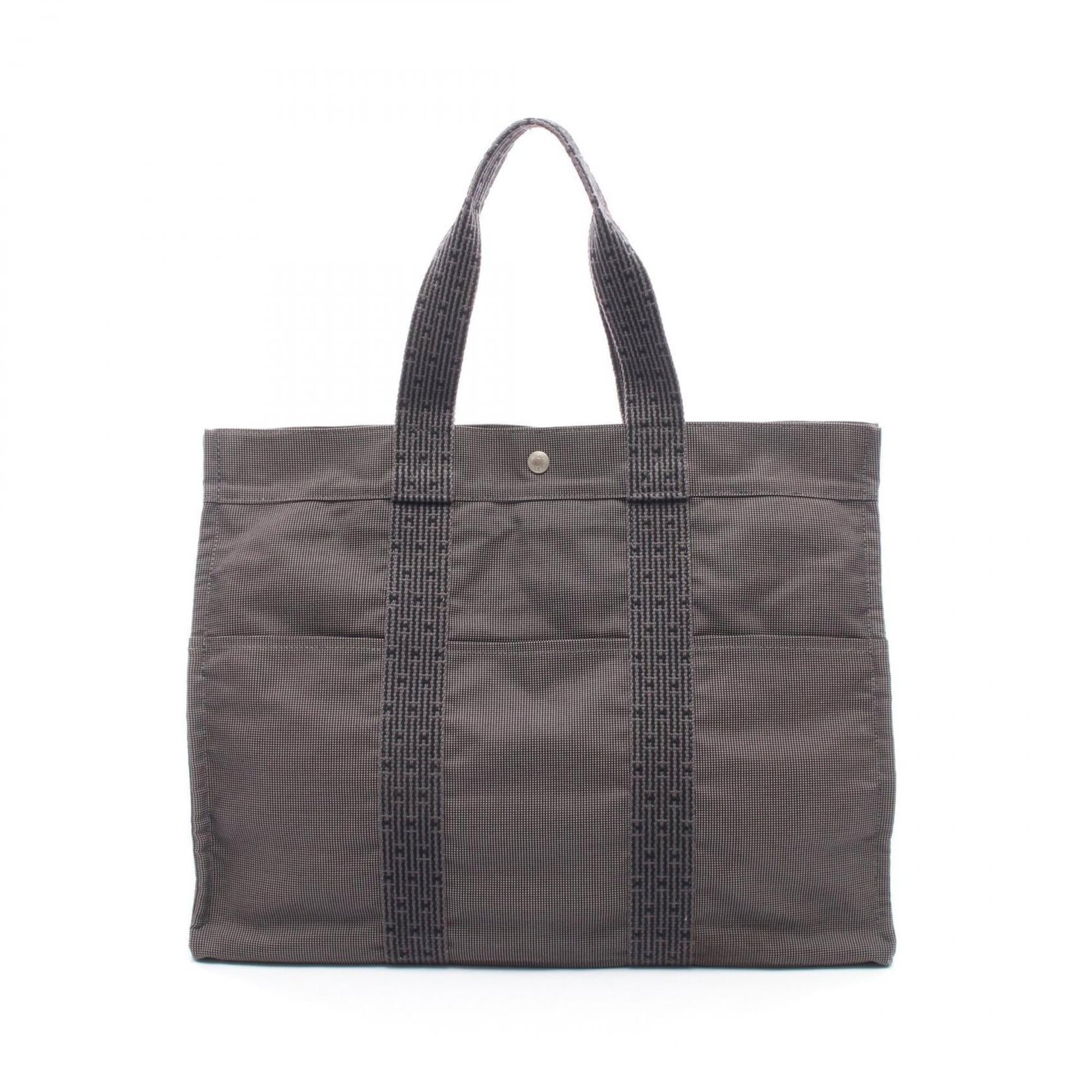 Handbag Tote Bag by Hermes: Handbag Tote Bag by Hermes Gray canvas tote bag by Hermes, featuring silver hardware and a classic design. Measuring 35cm x 46cm x 15cm, this versatile handbag is in very good condition with some