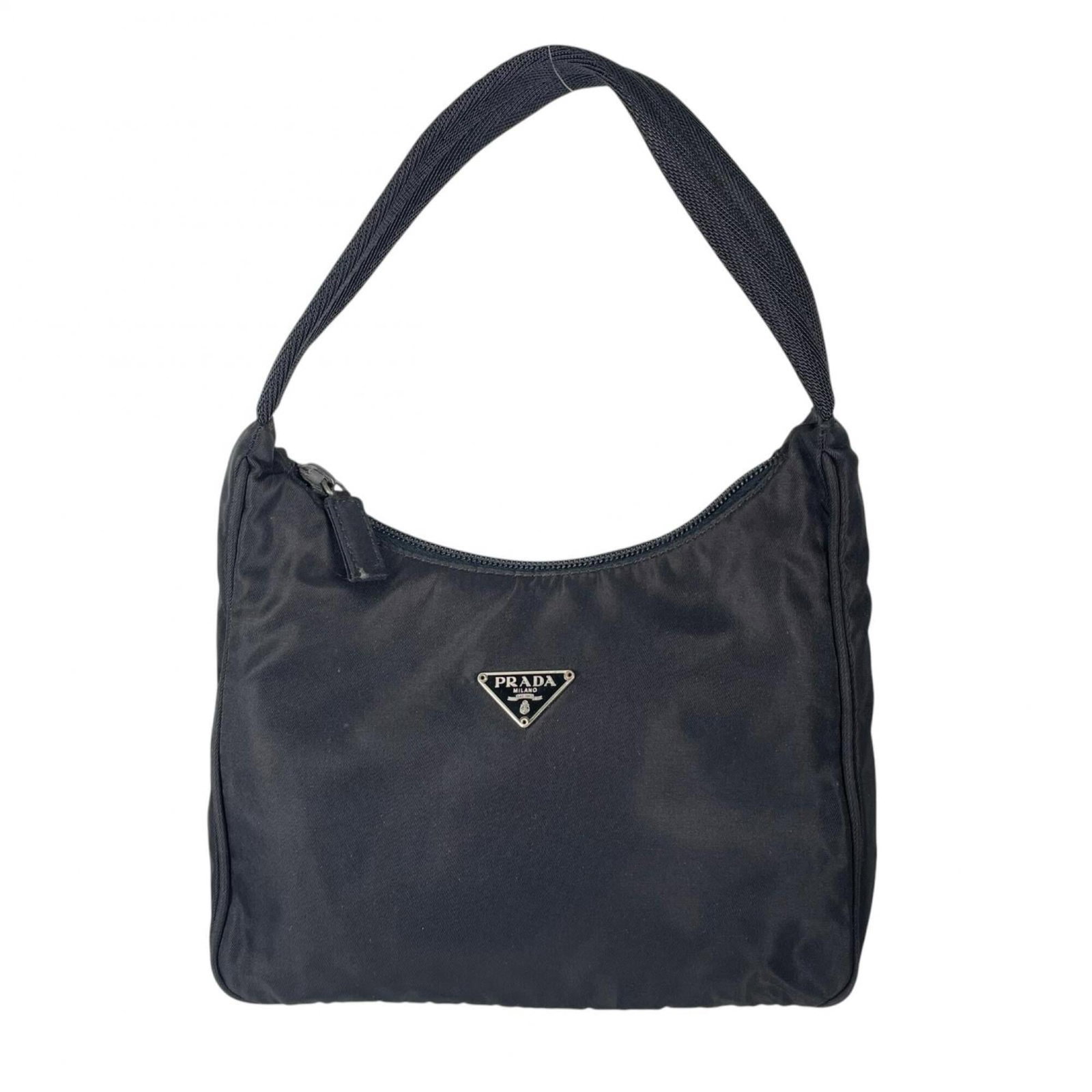 Prada Handbag Nylon: Prada Handbag Nylon Black Prada Nylon Handbag with Traces of Usage. This used handbag features nylon material and measures 19cm x 20cm x 7cm, showcasing a classic design. With traces of usage visible,