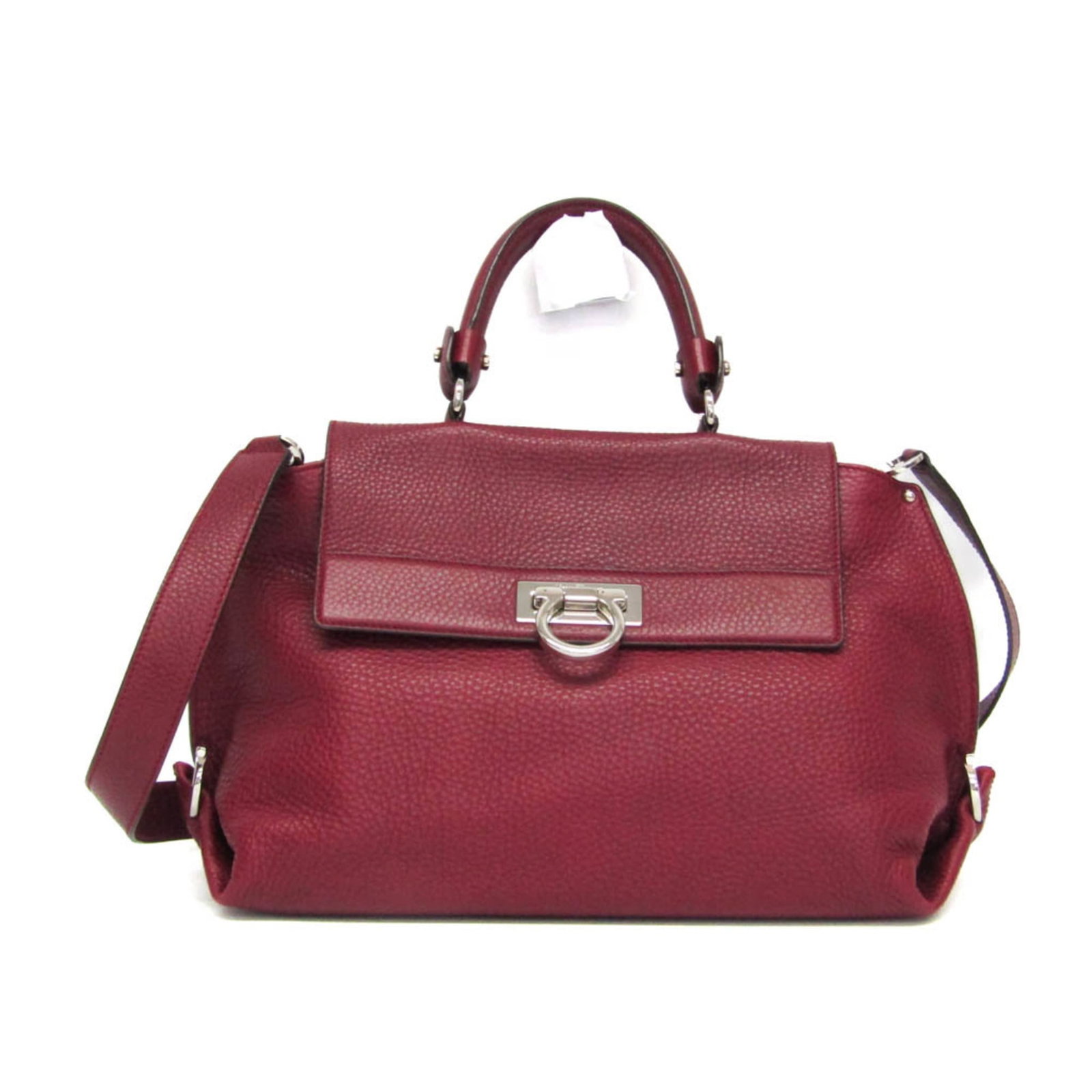 Ferragamo Salvatore Handbag Leather Shoulder Bag: Ferragamo Salvatore Handbag Leather Shoulder Bag Red leather shoulder bag with metal fasteners, featuring an open pocket and zipper pocket on the outer side. The bag measures 24cm x 32cm x 15cm and