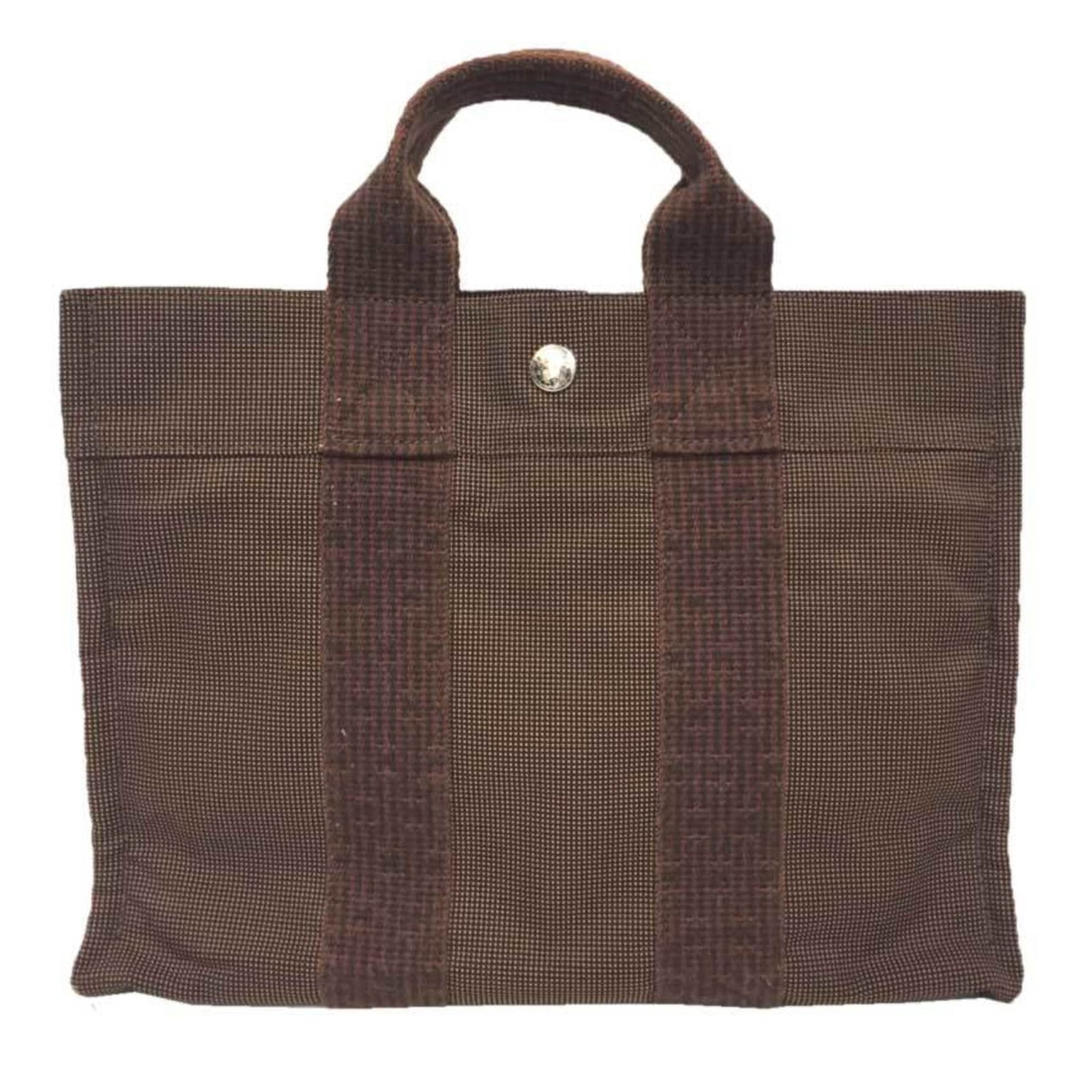 Hermes tote nylon canvas bag: Hermes tote nylon canvas bag Used Hermes tote nylon canvas bag in brown, featuring a classic design with a few traces of usage and some scratches/dirt. The bag measures 23cm x 30cm x 7.5cm and is in