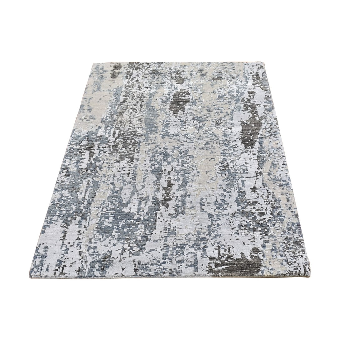 Ivory wool denser weave abstract design hand knotted rug: Ivory wool denser weave abstract design hand knotted rug Hand-knotted in wool, this abstract design rug boasts an intricate denser weave, adding depth and texture to any space. Featuring a striking iv