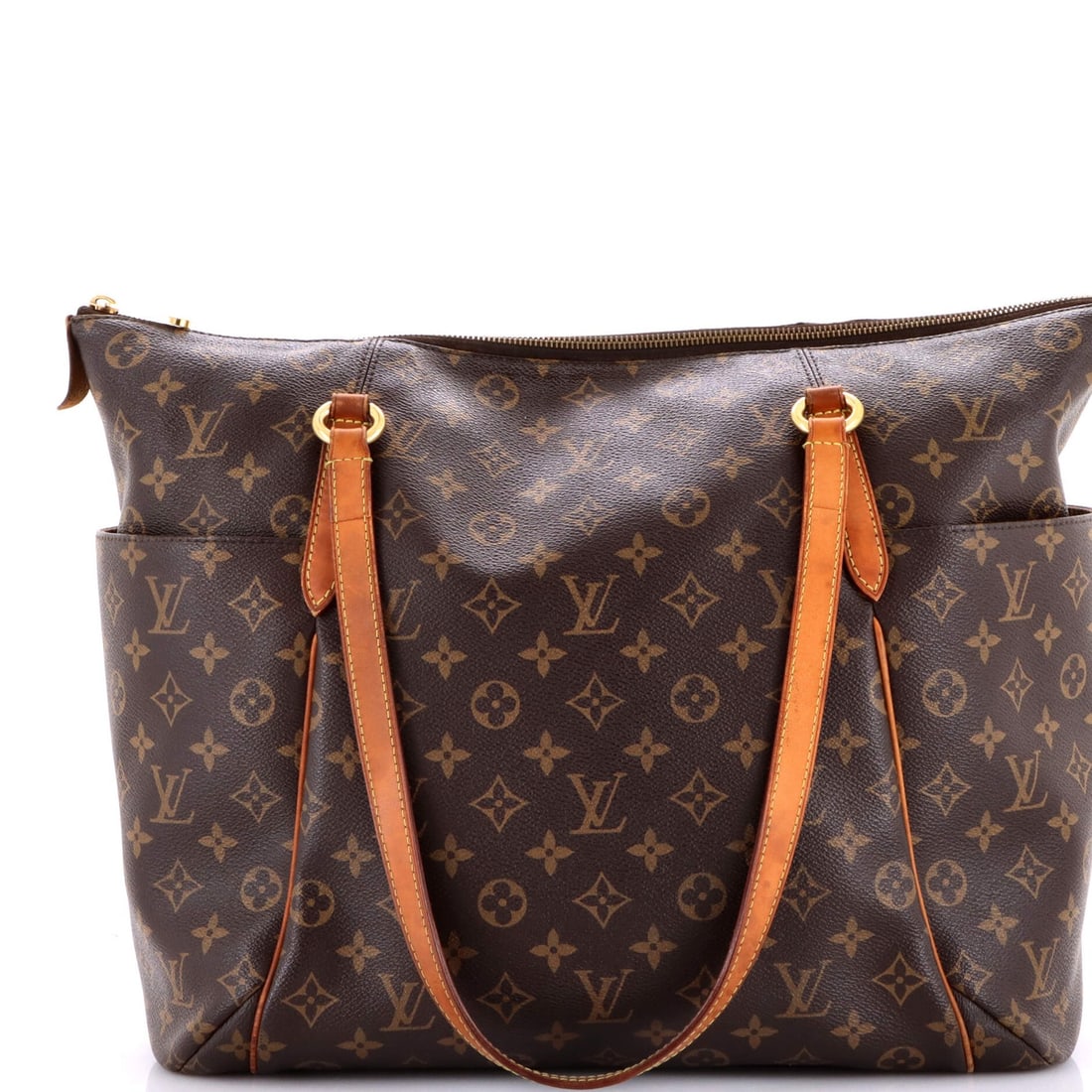 Canvas Monogram Louis Vuitton Totally Handbag: Canvas Monogram Louis Vuitton Totally Handbag Canvas Monogram Louis Vuitton Totally Handbag features a classic design with heavy corner wear, scuffs, and creases on the exterior. The bag's brown