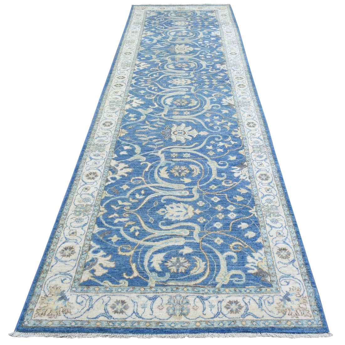 3'9"x13'3" Blue Fine Peshawar Soft Wool Hand Knotted Wide Runner Rug: 3'9"x13'3" Blue Fine Peshawar Soft Wool Hand Knotted Wide Runner Rug Blue Fine Peshawar Soft Wool Hand Knotted Wide Runner Rug measures 3'9"x13'3" in size, showcasing a stunning blue field with an ori