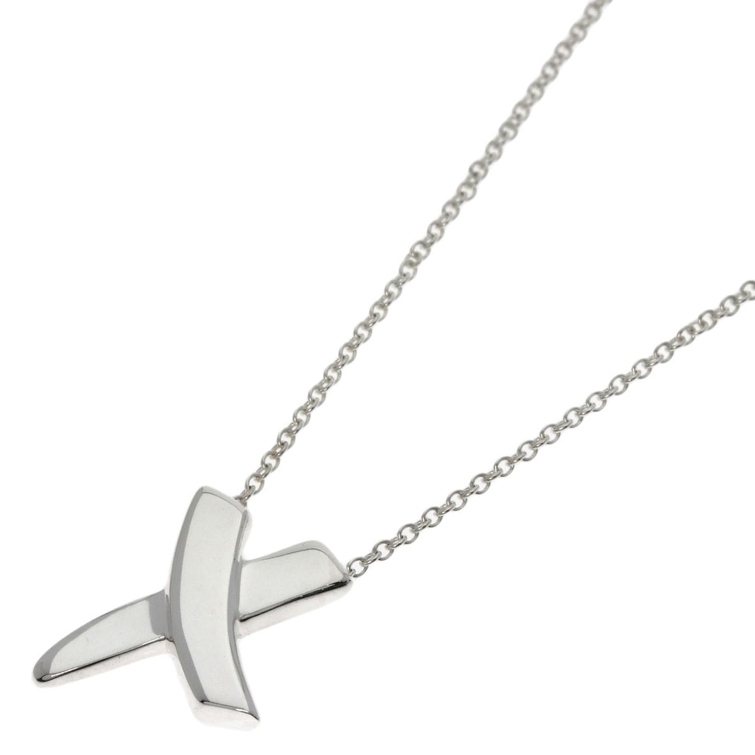 Kiss Necklace by Tiffany Co: Kiss Necklace by Tiffany Co Silver Kiss Necklace by Tiffany Co, featuring a sleek and modern design with no stone. This 16.1inch long necklace showcases the brand's signature style in silver metal.