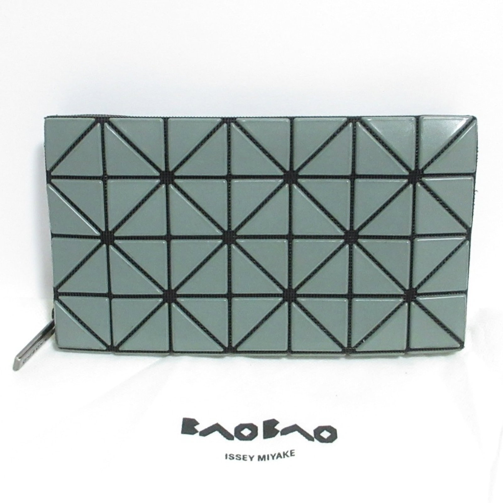 Issey Miyake Polyester Bi Fold Bao Wallet: Issey Miyake Polyester Bi Fold Bao Wallet Smoke Green Polyester Bi Fold Bao Wallet by Issey Miyake features a sleek, long design with a bi-fold structure. Made from high-quality polyester, this wallet