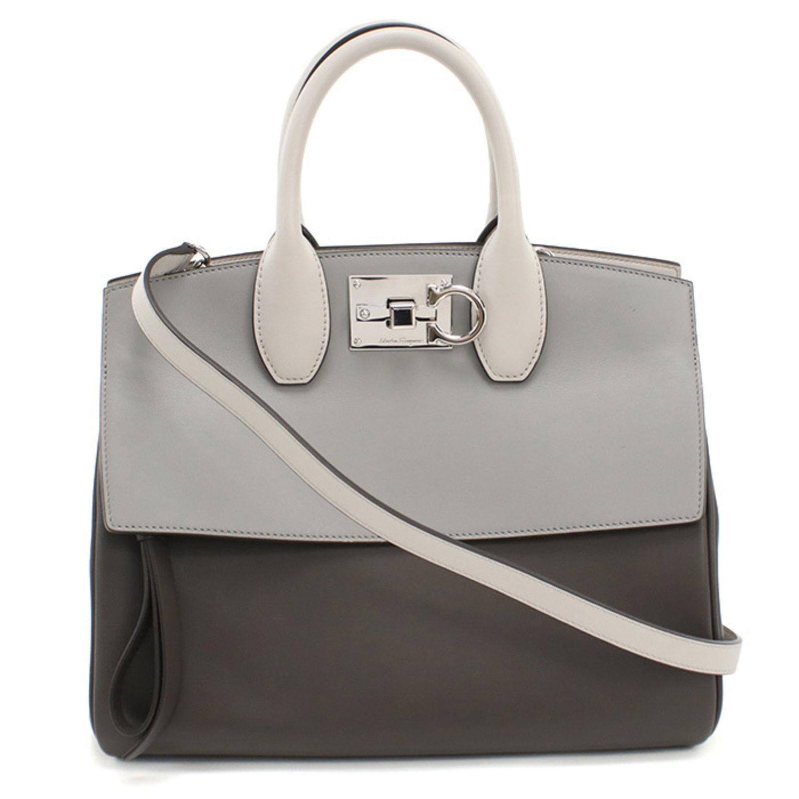 Handbag Leather by Salvatore Ferragamo: Handbag Leather by Salvatore Ferragamo Gray leather handbag by Salvatore Ferragamo, featuring calfskin material and silver hardware. Measuring 24cm x 30cm x 15cm, it showcases a few traces of usage