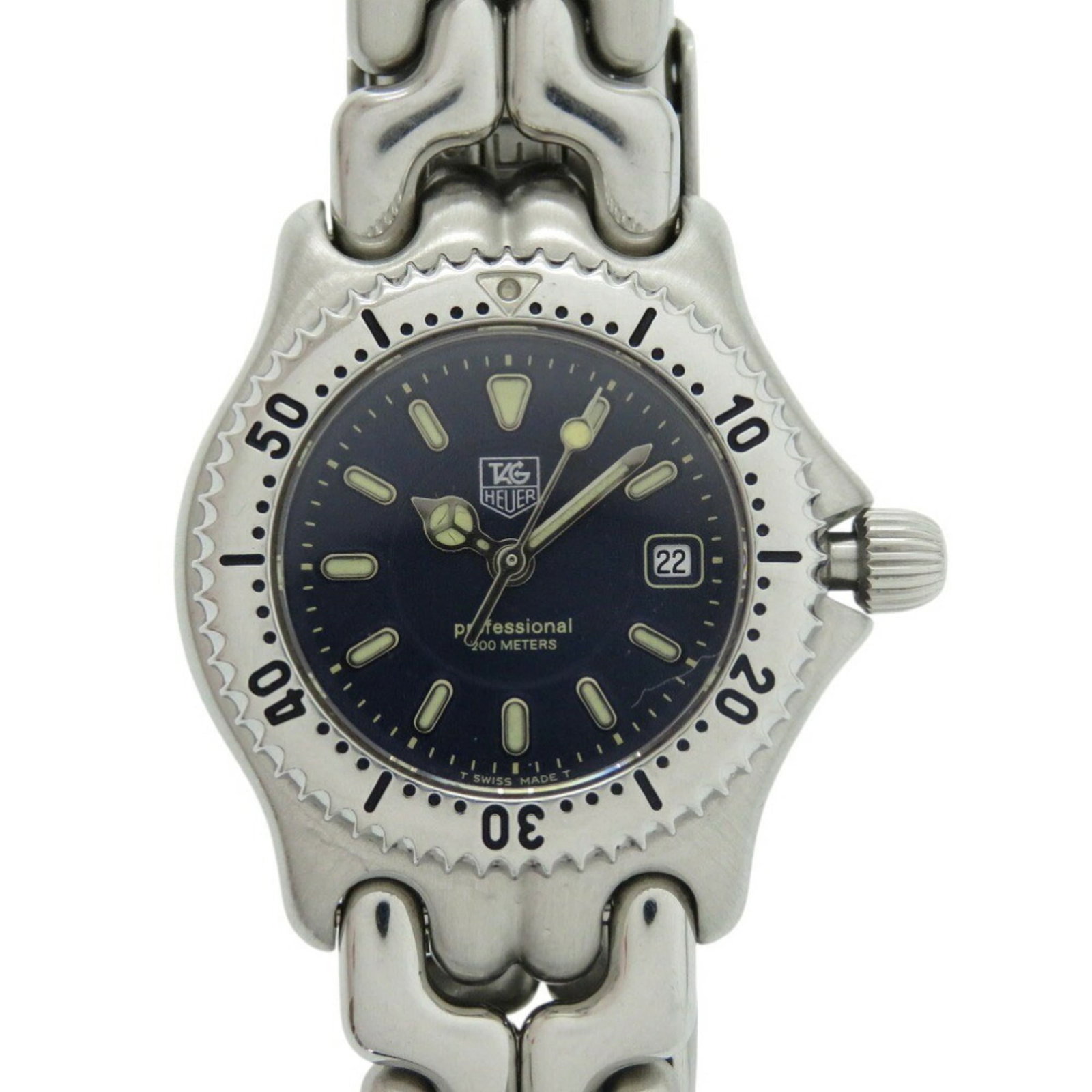 Wristwatch by Heuer: Wristwatch by Heuer Stainless steel case and band, the Heuer wristwatch features a navy dial with an analog display. Traces of usage are visible, including scratches and dirt, but overall it remains