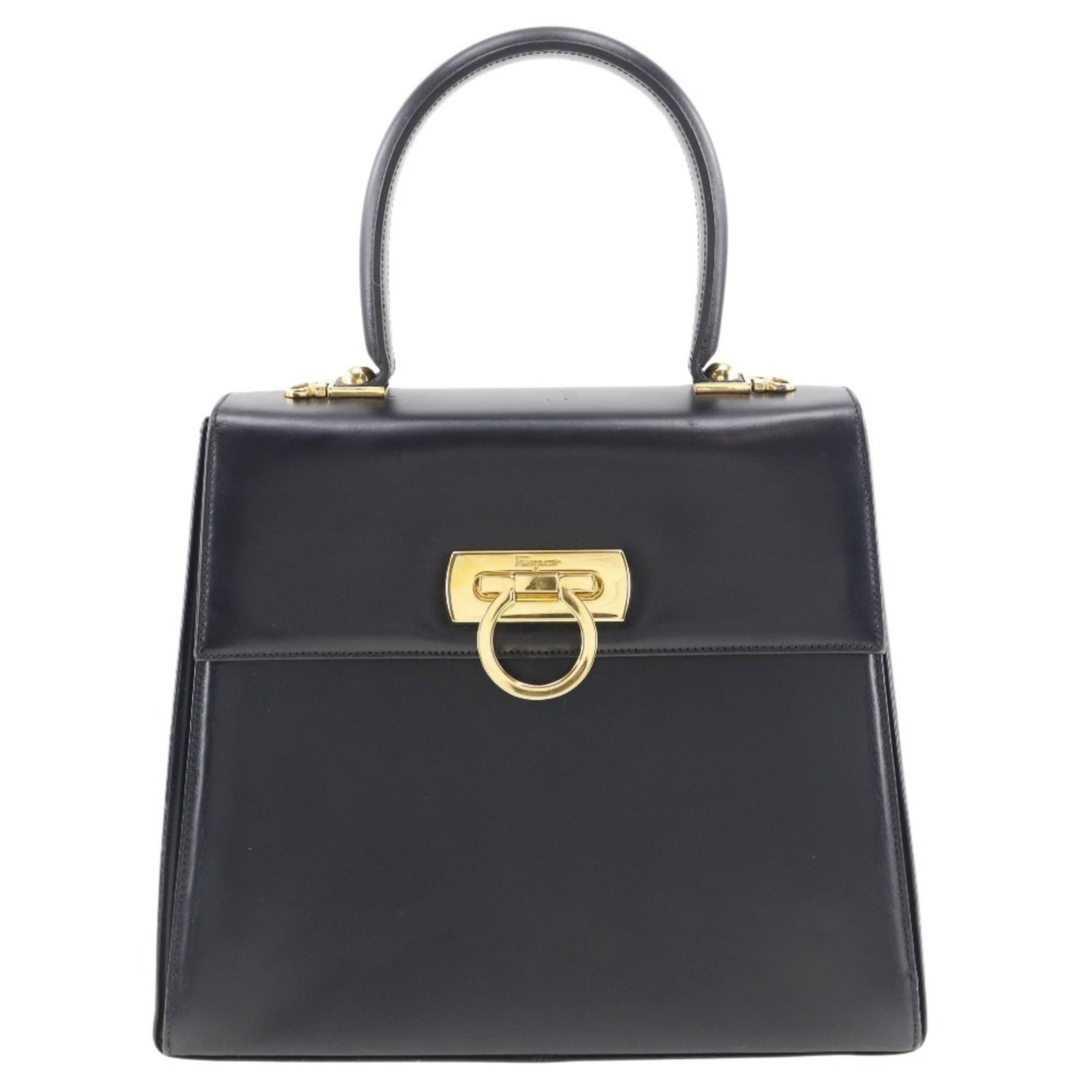 Handbag Leather by Salvatore Ferragamo: Handbag Leather by Salvatore Ferragamo This Salvatore Ferragamo handbag features high-quality black leather, adorned with a classic flap closure and zippered pocket. With its sturdy calfskin