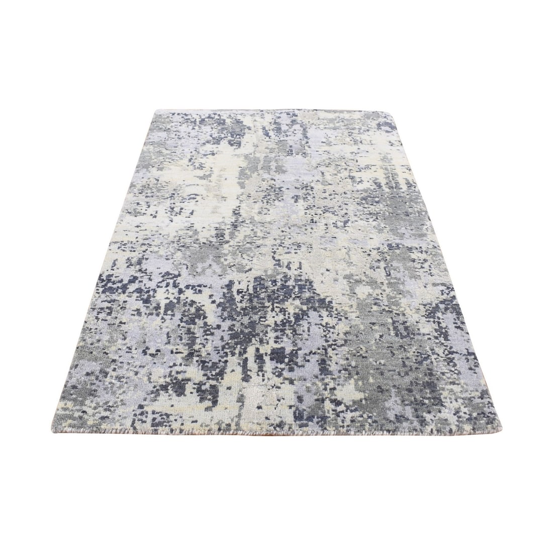 2'1"x3' White Abstract Design Wool and Silk Hand Knotted Mat Rug: 2'1"x3' White Abstract Design Wool and Silk Hand Knotted Mat Rug Abstract Design Wool and Silk Hand Knotted Mat Rug features an intricate, hand-knotted pattern in ivory silk and wool. Measuring 2'1" x