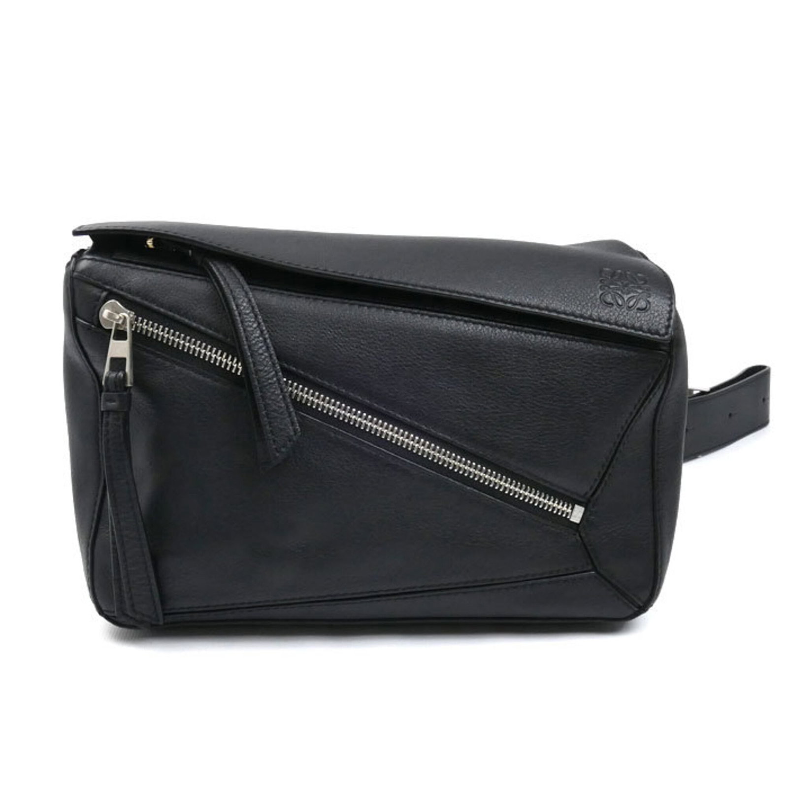 Sling Bag by Loewe: Sling Bag by Loewe Black Loewe Sling Bag with silver hardware, measuring 16cm x 25cm x 10cm. This used bag shows traces of usage and minor scratches/dirt, but remains in good condition overall. A clas