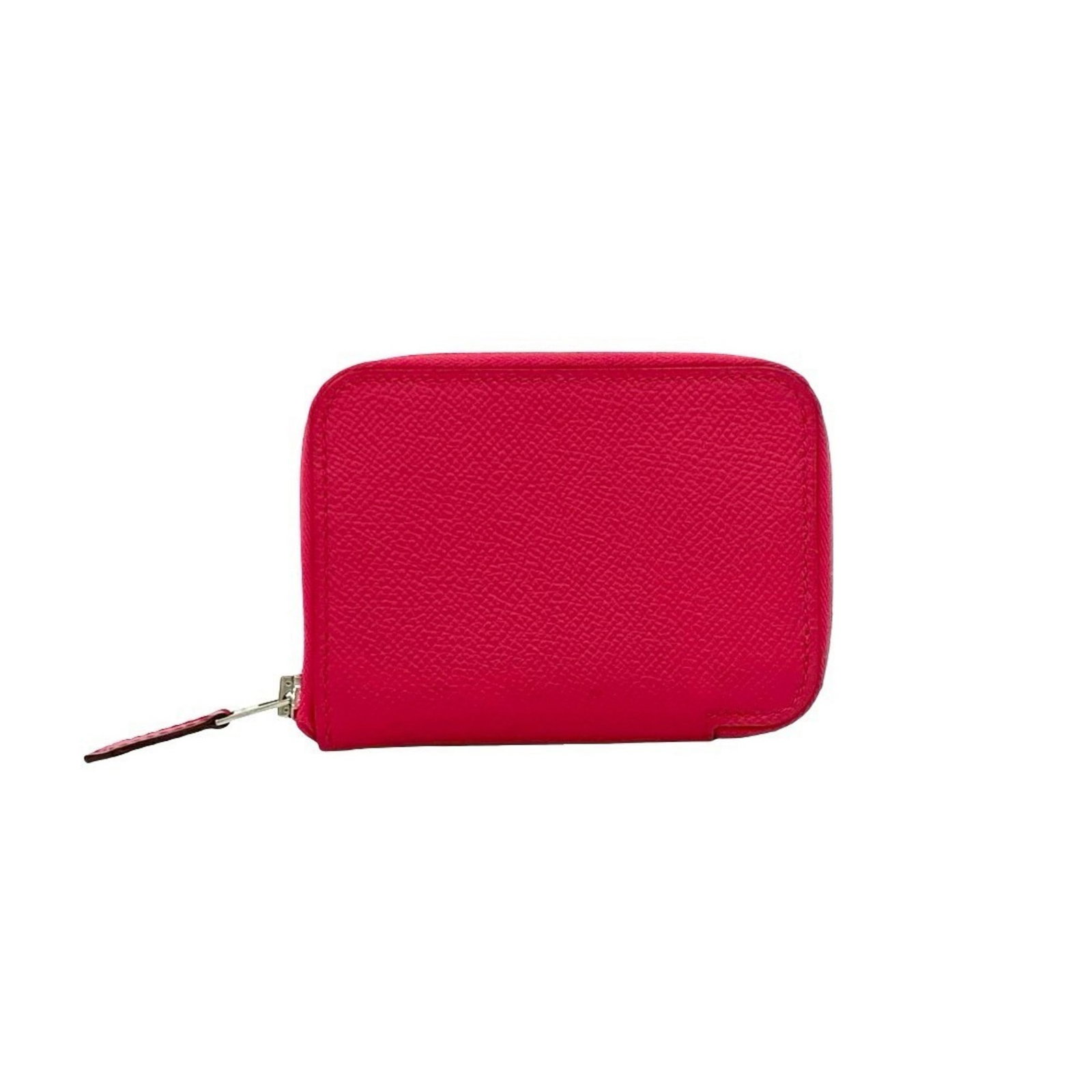 Coin purse leather case Hermes: Coin purse leather case Hermes Pink leather coin purse case from Hermes, featuring a classic design with a few traces of usage visible. The item has some scratches and dirt, but remains in very good c