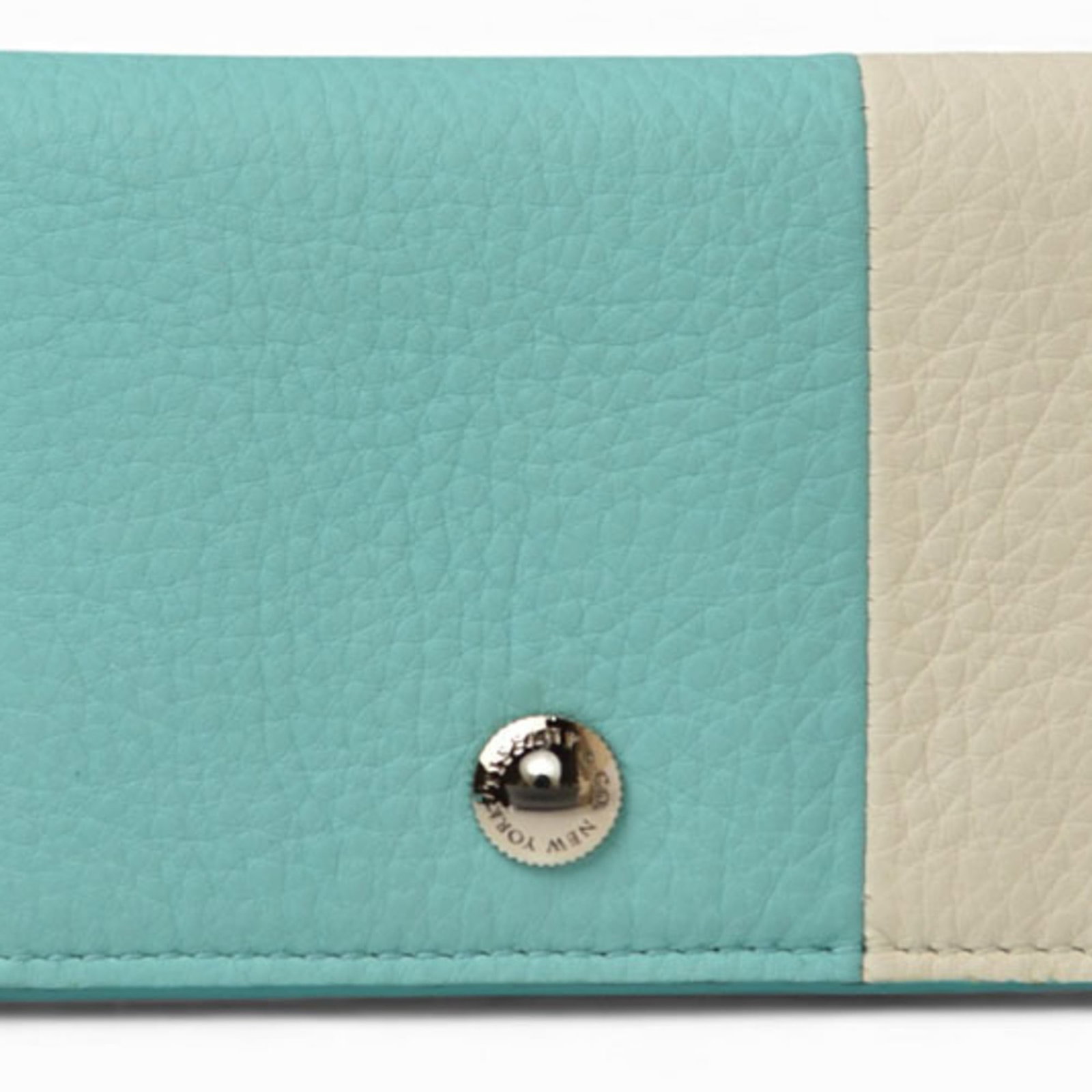 Card case leather by Tiffany: Card case leather by Tiffany Leather card case by Tiffany, made from high-quality material and available in cream or Tiffany Blue color options. This item is in mint condition, like new, with a used a