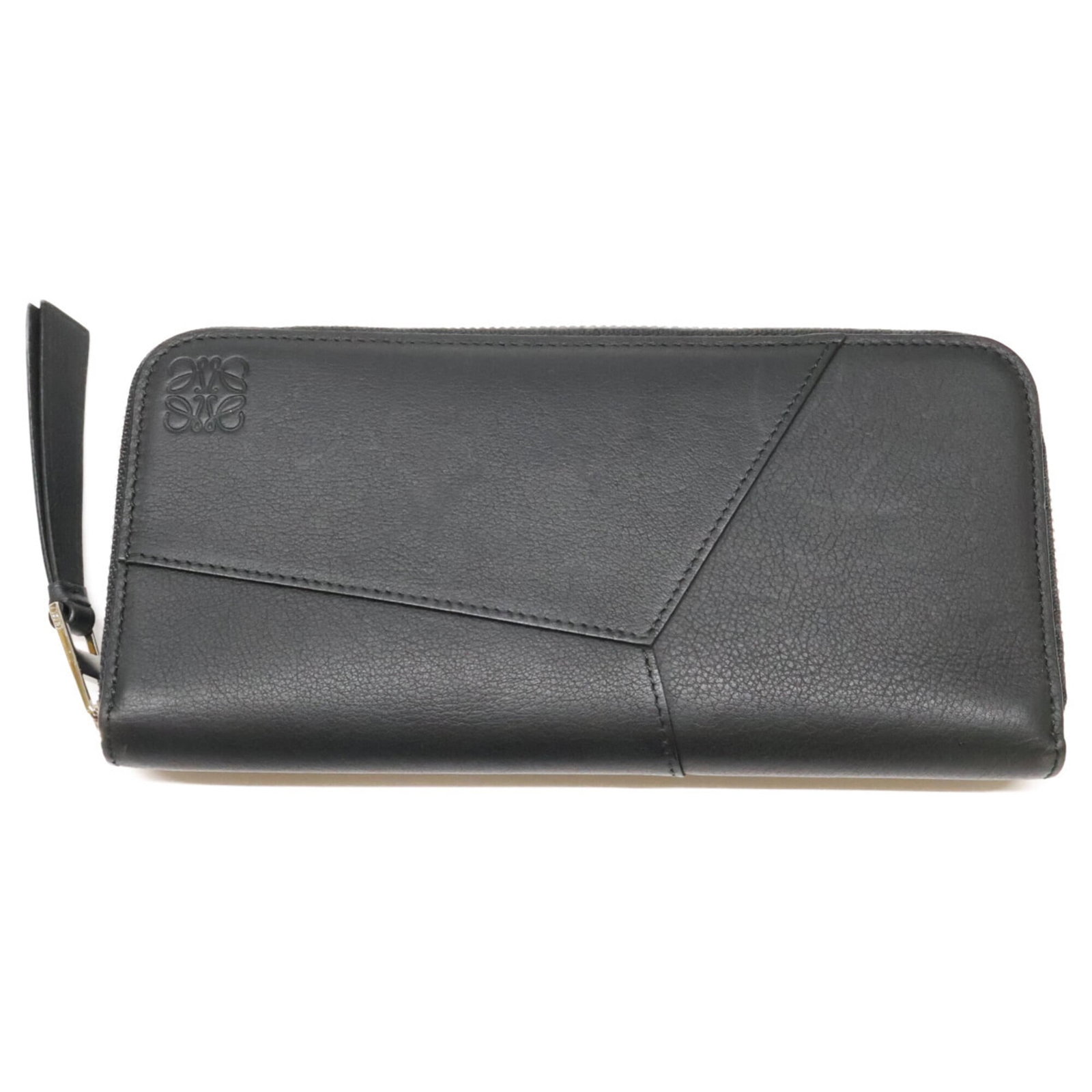 Leather Bi Fold Wallet Long Loewe: Leather Bi Fold Wallet Long Loewe Long Loewe Leather Bi Fold Wallet in Black Calfskin. This used bi-fold wallet features high-quality leather and measures 20cm x 9.5cm x 2cm, with a few traces of
