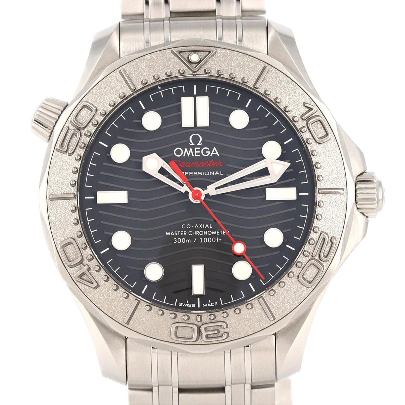 Omega Wristwatch: Omega Wristwatch Stainless steel case and band provide a rugged, durable foundation for this Omega wristwatch. The black dial stands out against the subtle wear and minor scratches that give this