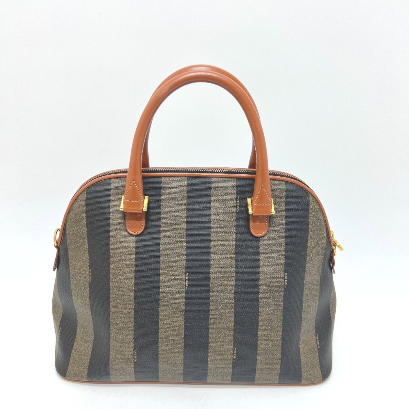 PVC leather shoulder bag by Fendi: PVC leather shoulder bag by Fendi Fendi's PVC leather shoulder bag boasts a unique blend of materials and style. With its brown color and distinctive design, this shoulder bag stands out as a
