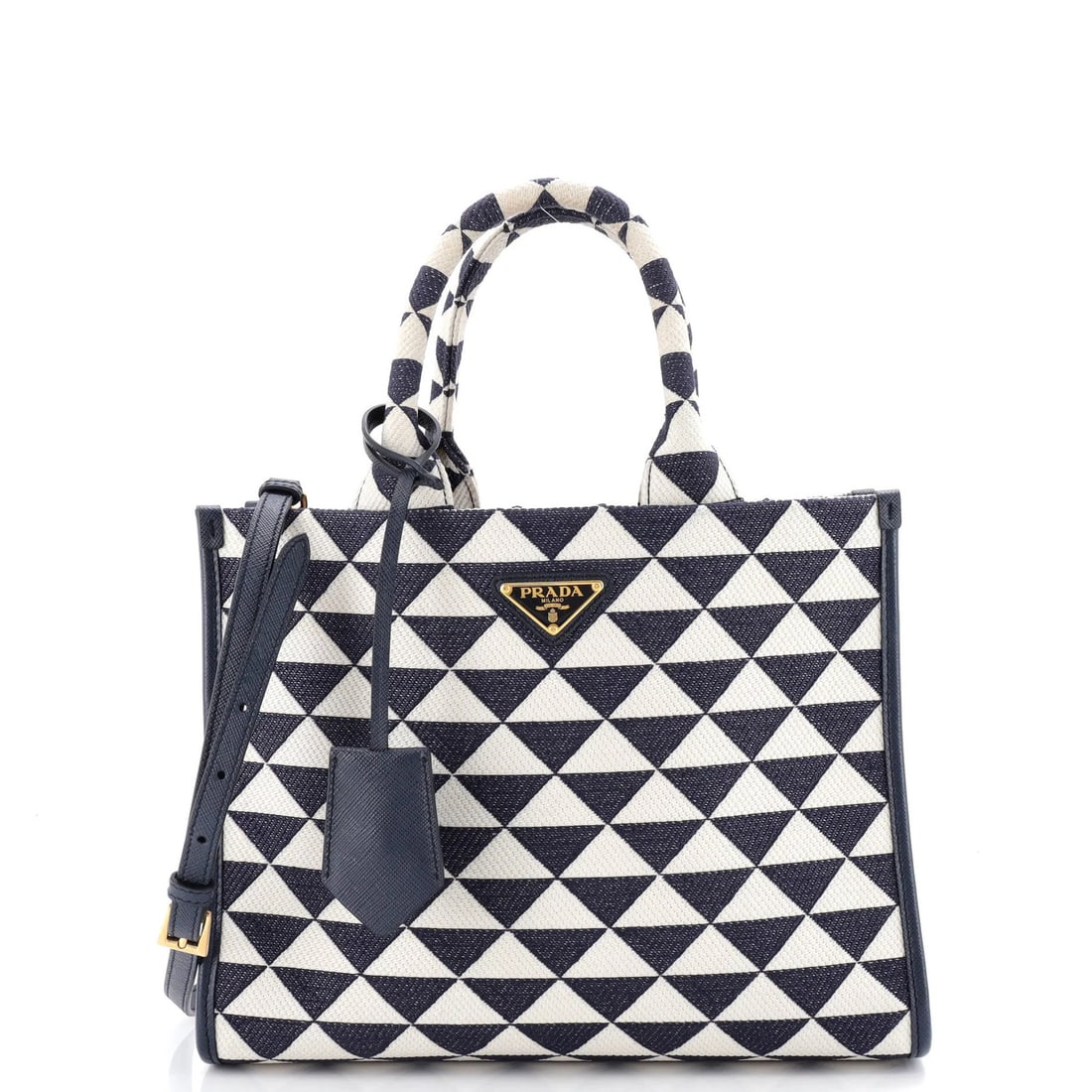 Symbole Small Shopper Prada Tote Jacquard: Symbole Small Shopper Prada Tote Jacquard Small, stylish Symbole Shopper Tote Prada in blue canvas exterior with gold hardware. Features a classic design with a Jacquard weave pattern and a spacious i