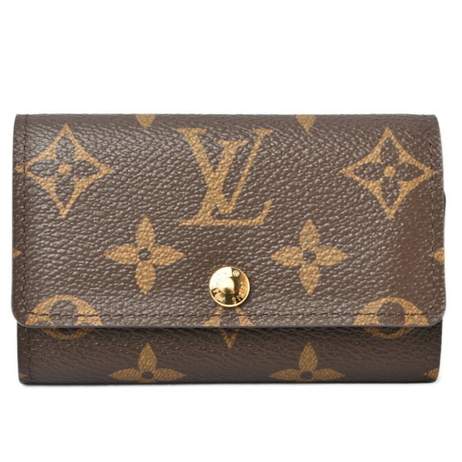 Keycase of Monogram Louis Vuitton: Keycase of Monogram Louis Vuitton Monogram Louis Vuitton Keycase in Mint Condition. This used keycase boasts the iconic Monogram pattern, showcasing the brand's signature style and craftsmanship. In l
