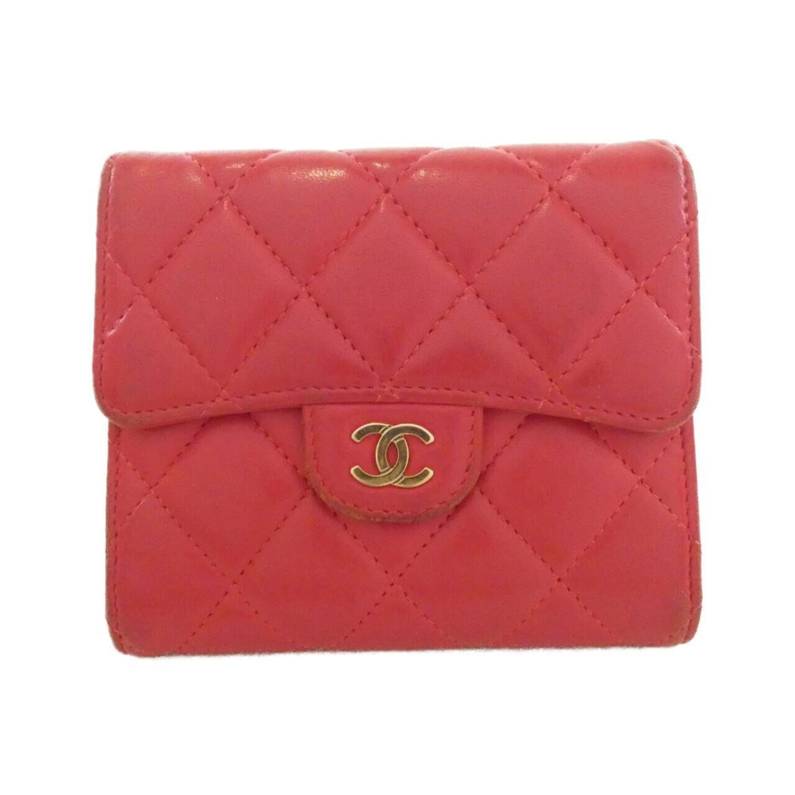 Chanel Wallet (Tri-Fold) Leather: Chanel Wallet (Tri-Fold) Leather This Chanel Tri-Fold Wallet in pink lamb leather features a classic design with a tri-fold layout. With its used condition and some traces of usage, it still retains i