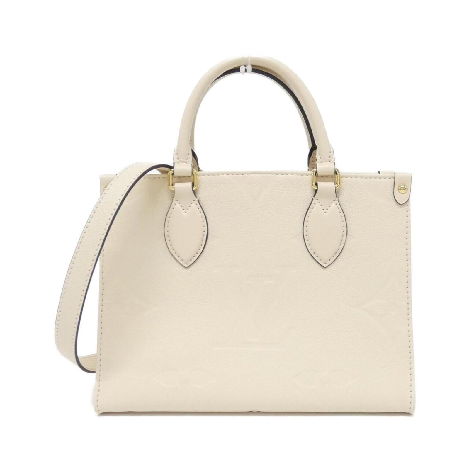 Louis Vuitton Handbag Leather: Louis Vuitton Handbag Leather This Louis Vuitton handbag features genuine leather made from high-quality calfskin, with a classic beige color. The bag has some minor signs of usage, including scratche