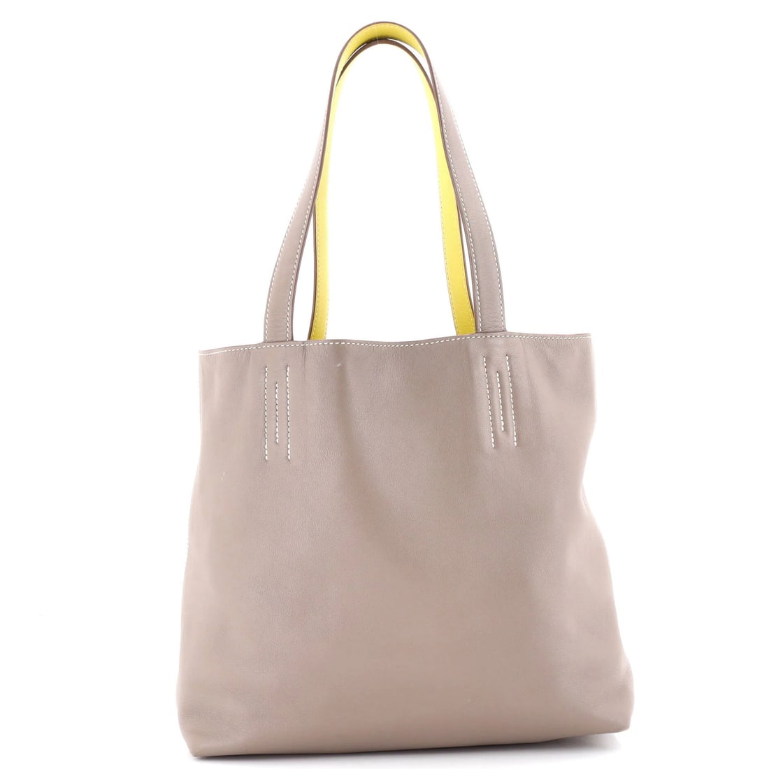 Double Sens Veau Sikkim 28 by Hermes: Double Sens Veau Sikkim 28 by Hermes Double Sens Veau Sikkim 28 by Hermes, a timeless gray leather tote with subtle scuffs and creases. This versatile bag boasts a spacious interior with yellow