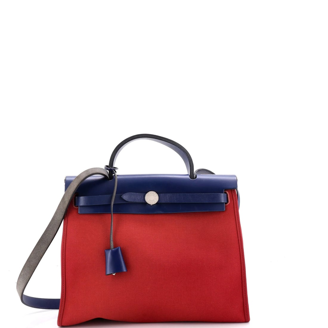 Hermes Herbag Zip Leather and Toile 31: Hermes Herbag Zip Leather and Toile 31 The Herm?s Herbag Zip Leather and Toile 31 is a stylish shoulder bag with a striking red exterior. Its durable leather and canvas construction, combined with