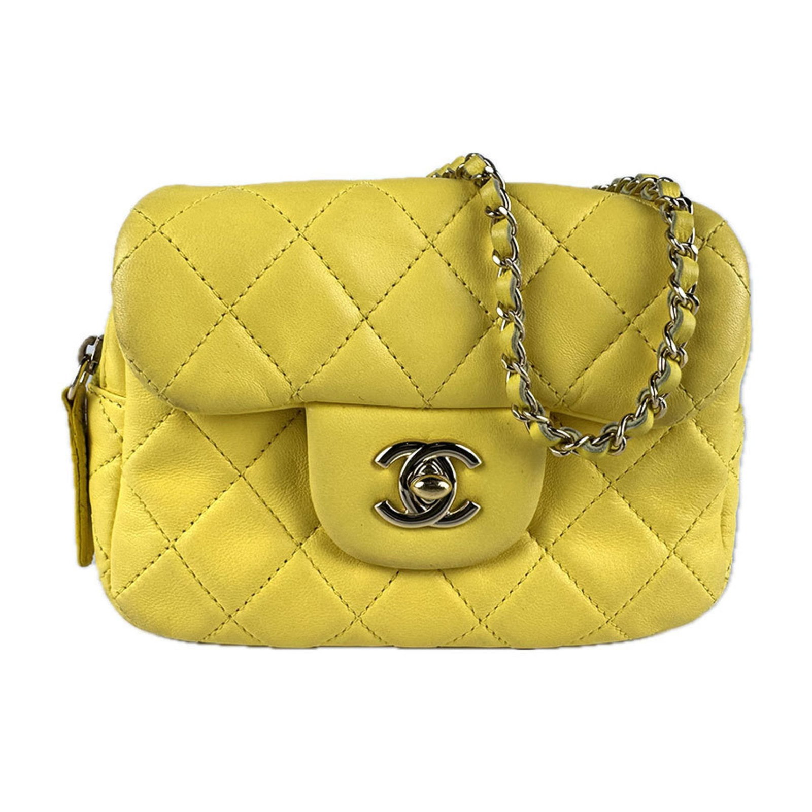 Shoulder bag leather Chanel: Shoulder bag leather Chanel Yellow lambskin shoulder bag from Chanel, featuring high-quality leather construction with visible traces of usage and minor scratches. The bag measures 12cm x 15cm x 5cm