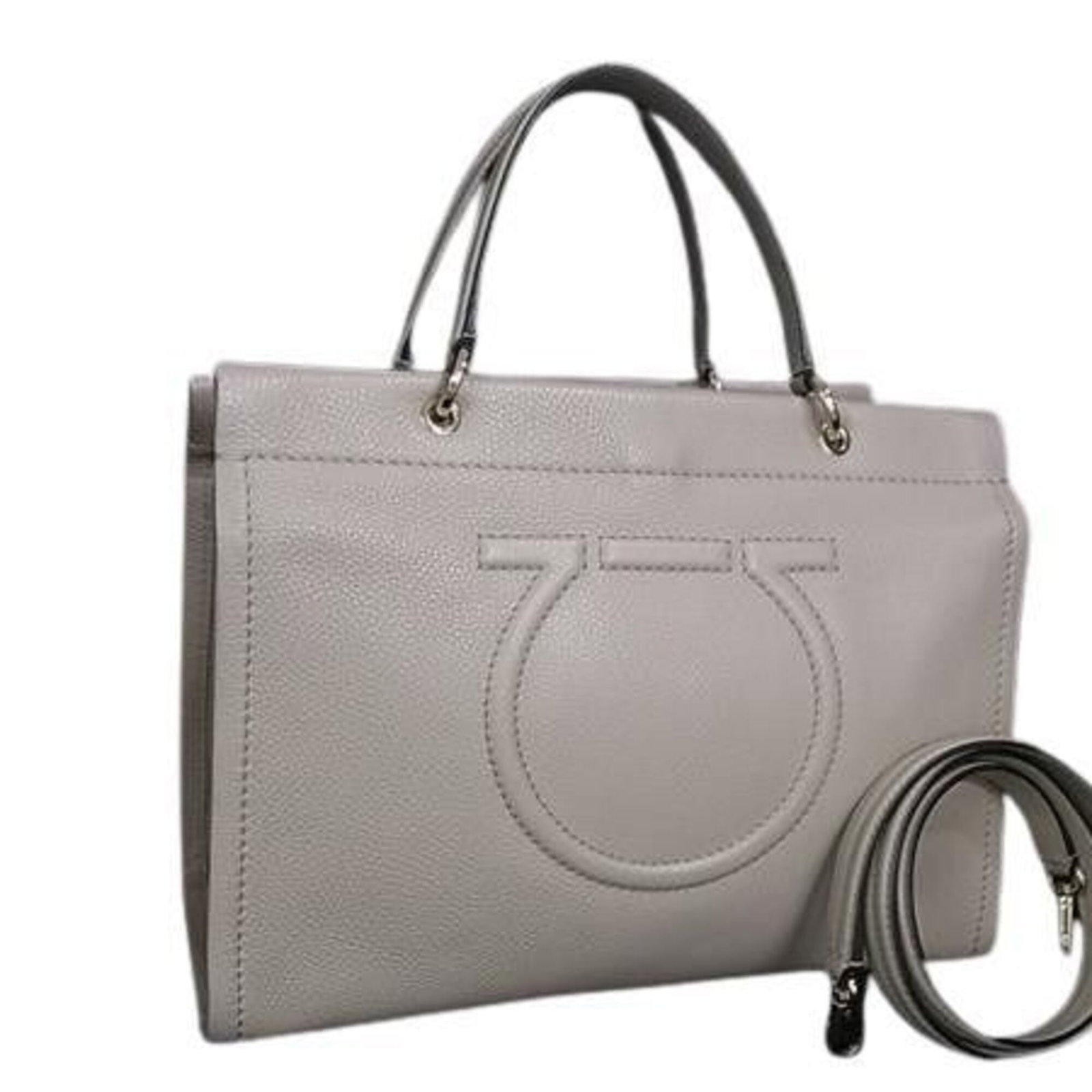 Shoulder Bag Leather Handbag Salvatore Ferragamo: Shoulder Bag Leather Handbag Salvatore Ferragamo This luxurious shoulder bag features rich, grayish leather and the iconic Salvatore Ferragamo design. With its classic shape and timeless style, it's