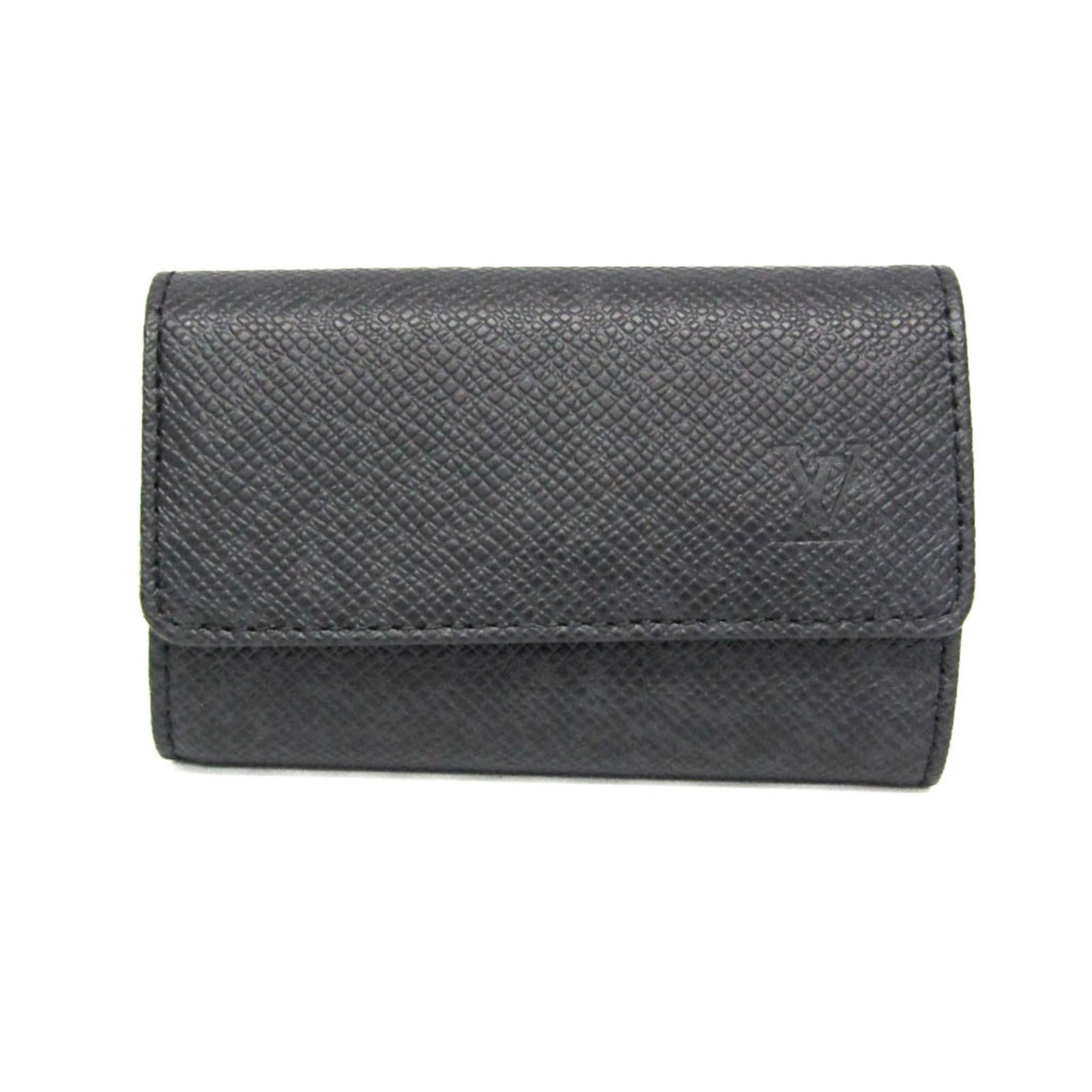 Louis Vuitton Keycase Taiga Leather: Louis Vuitton Keycase Taiga Leather Taiga Leather Keycase from Louis Vuitton features snap closure and six key hooks, showcasing the iconic brand's signature style. The item bears a few traces of