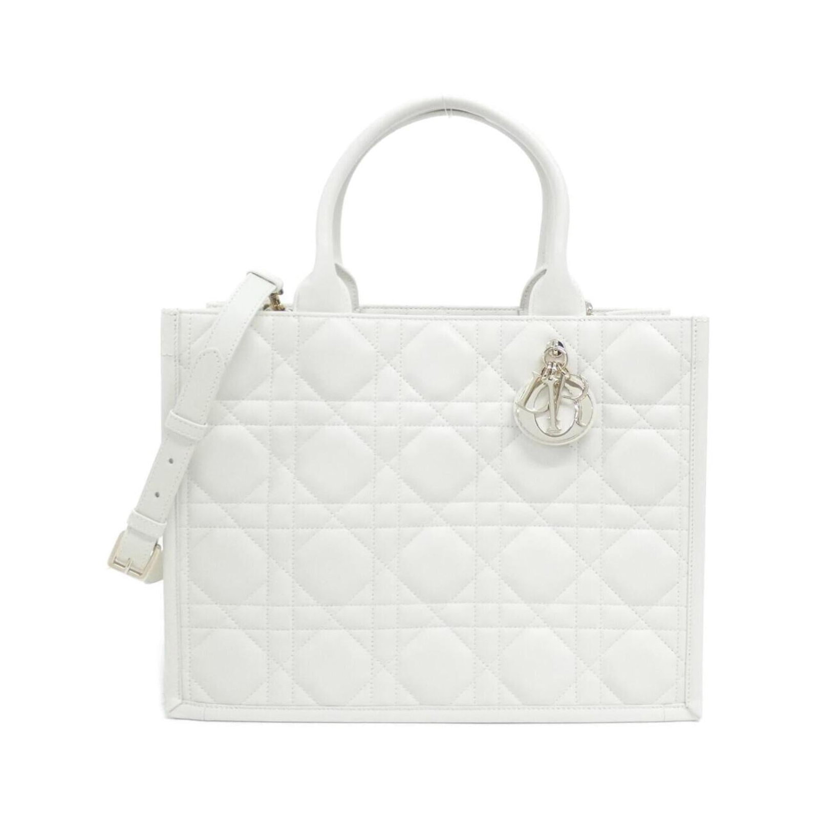 Handbag Christian Dior Leather: Handbag Christian Dior Leather White Calfskin Christian Dior Leather Handbag. This pre-owned handbag features a classic design with a white leather exterior and measures 28cm x 36cm x 17cm. With some