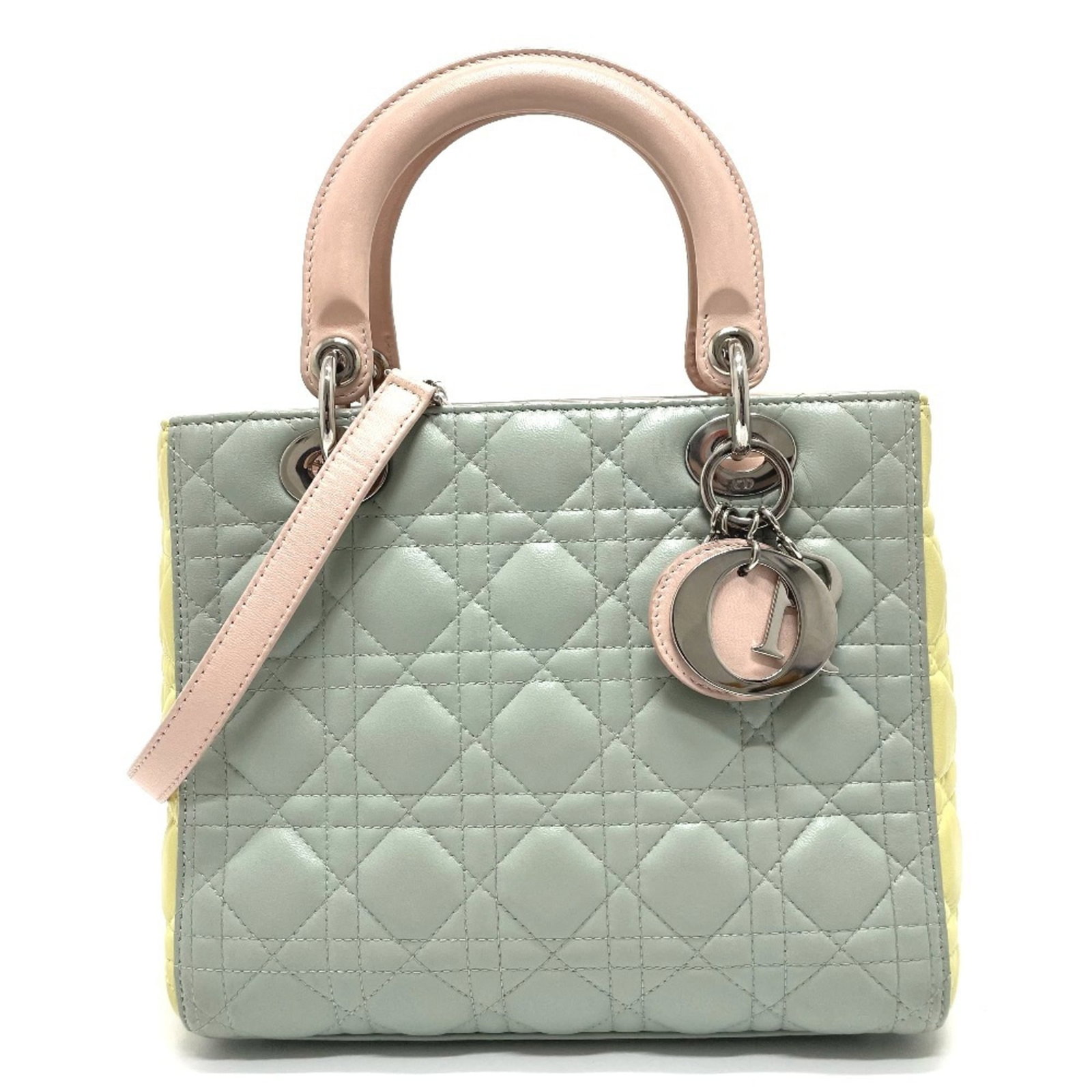 Christian Dior Handbag Shoulder Bag Leather: Christian Dior Handbag Shoulder Bag Leather The Christian Dior Handbag Shoulder Bag Leather features a striking blue, pink, and yellow color palette. Made from high-quality leather, this shoulder bag 