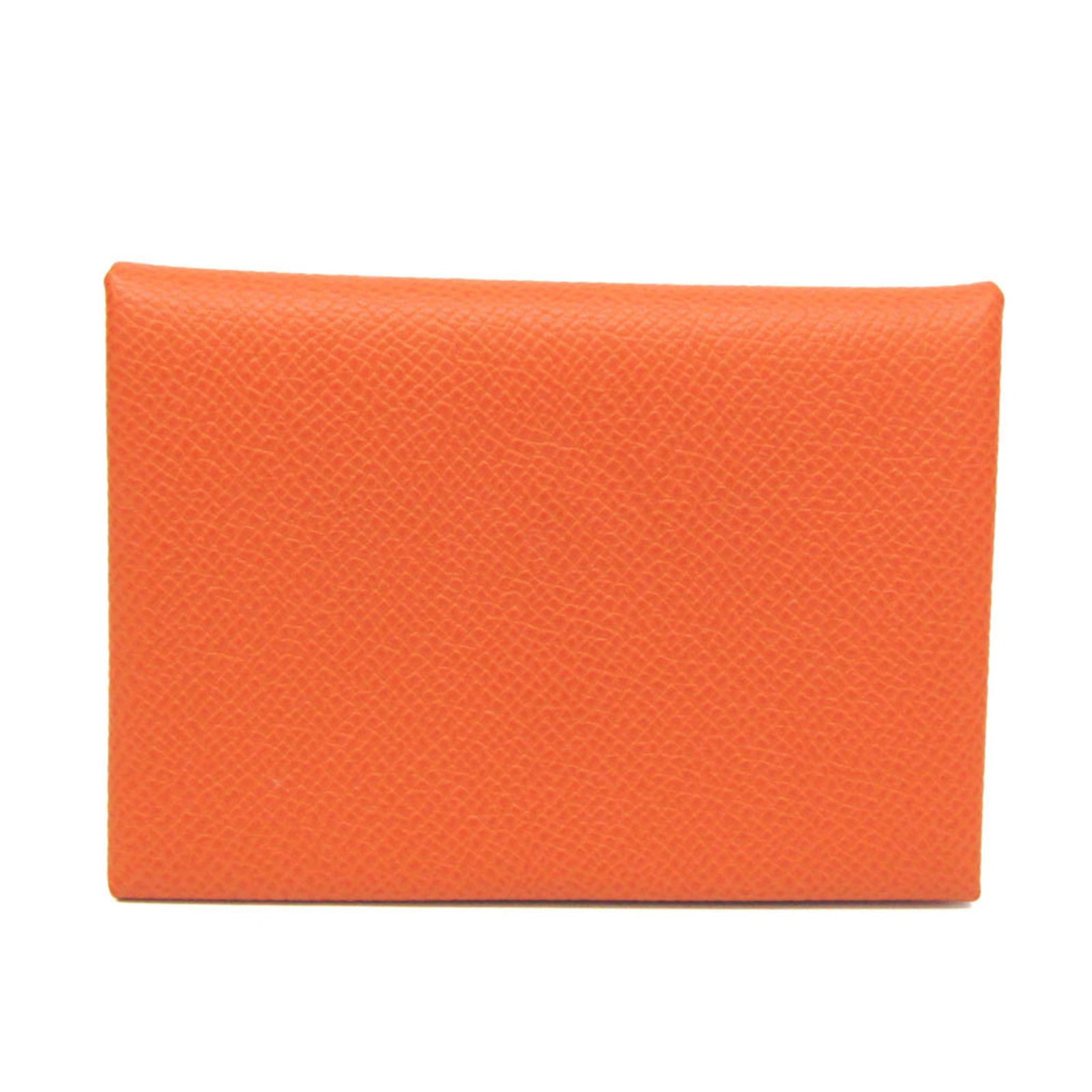 Epsom leather card case from Hermes: Epsom leather card case from Hermes Epsom leather card case from Hermes features Epsom leather, snap fastener closure, and an inner coin purse for added convenience. The vibrant orange color adds a