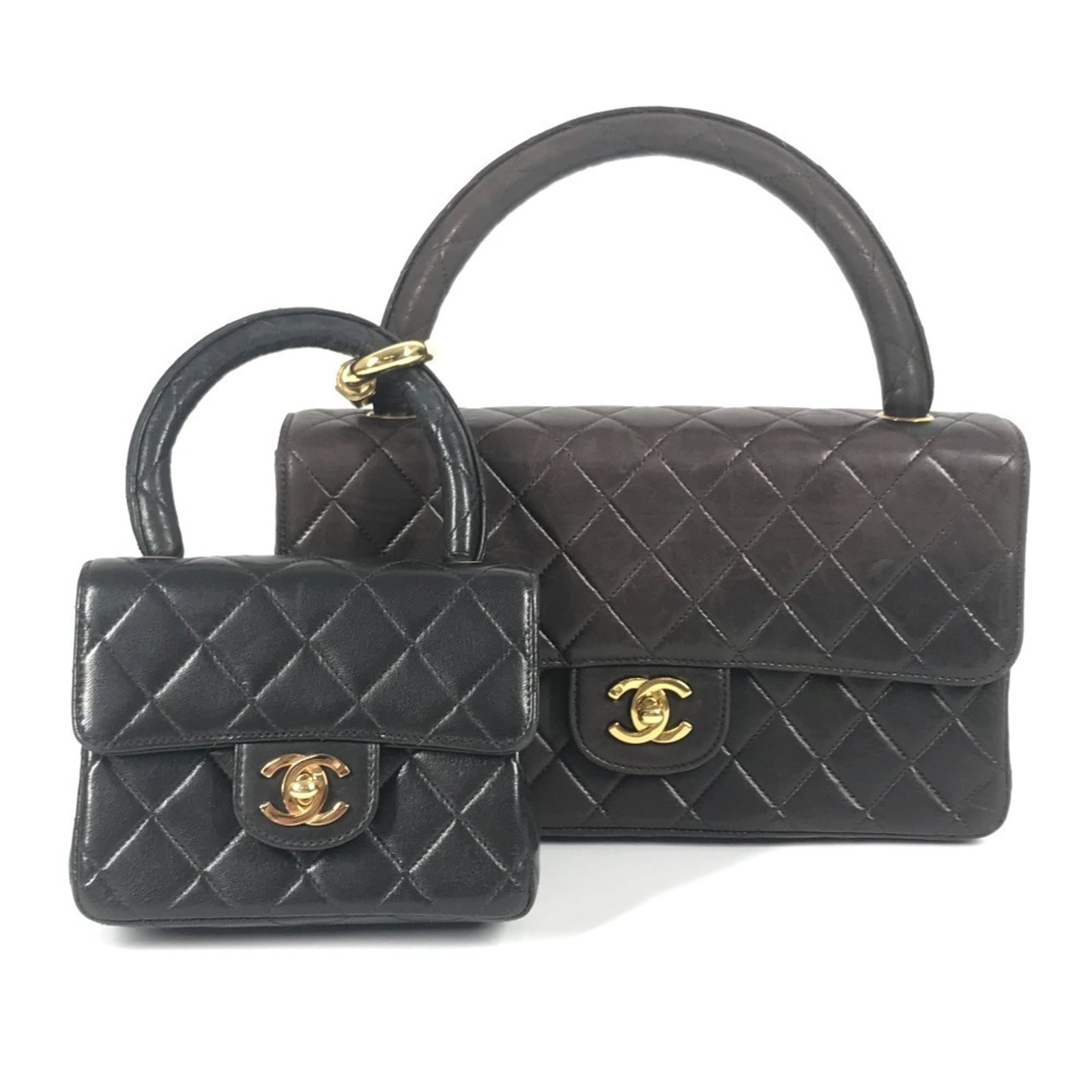 Chanel Handbag Tote Bag Leather: Chanel Handbag Tote Bag Leather Black Chanel Handbag Tote Bag in Lambskin Leather. This used tote bag features traces of usage and minor scratches, with some dirt visible. In good condition overall, i