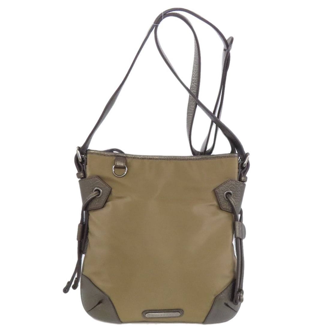 Burberry Nylon Bag Logo Shoulder: Burberry Nylon Bag Logo Shoulder Brown nylon bag with iconic Burberry logo on the shoulder. Made from durable nylon, this classic shoulder bag features a timeless design that has become synonymous