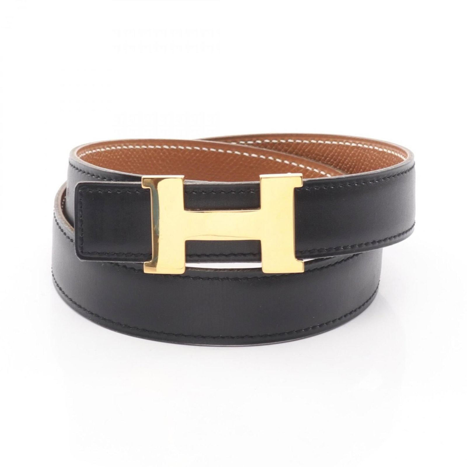 Standard Belt of Hermes: Standard Belt of Hermes A black leather standard belt from the iconic French fashion house Hermes, featuring a classic design with subtle signs of wear. Measuring 57cm-62cm in length, it offers a