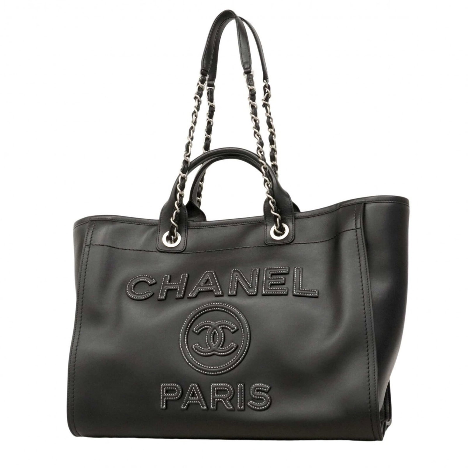 Chanel Handbag Leather: Chanel Handbag Leather Black lambskin Chanel handbag with silver hardware, featuring a classic design and timeless style. The bag has been used and shows traces of usage, including scratches and