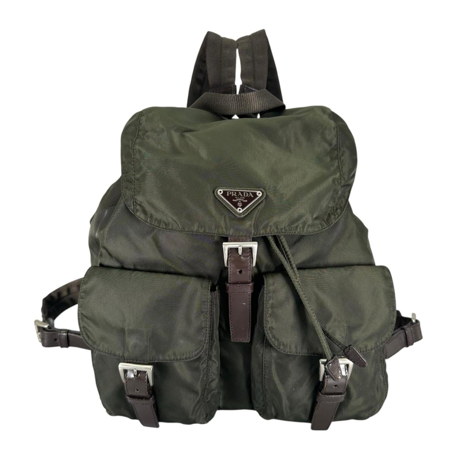 Nylon Backpack Prada: Nylon Backpack Prada Nylon backpack in khaki color with silver hardware, measuring 28cm x 30cm x 15cm. The Prada nylon backpack features a classic design with traces of usage visible, including