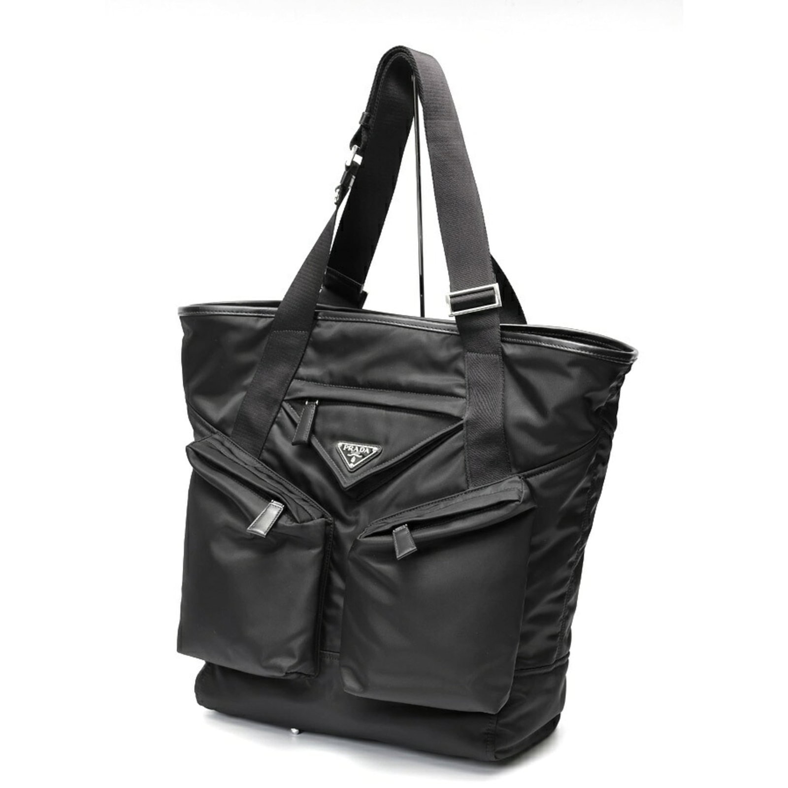 Nylon Leather Prada Tote: Nylon Leather Prada Tote Nylon and leather blend in sleek, modern design. This black Prada tote features a durable nylon exterior with subtle scratches and minor dirt marks, giving it a well-loved loo