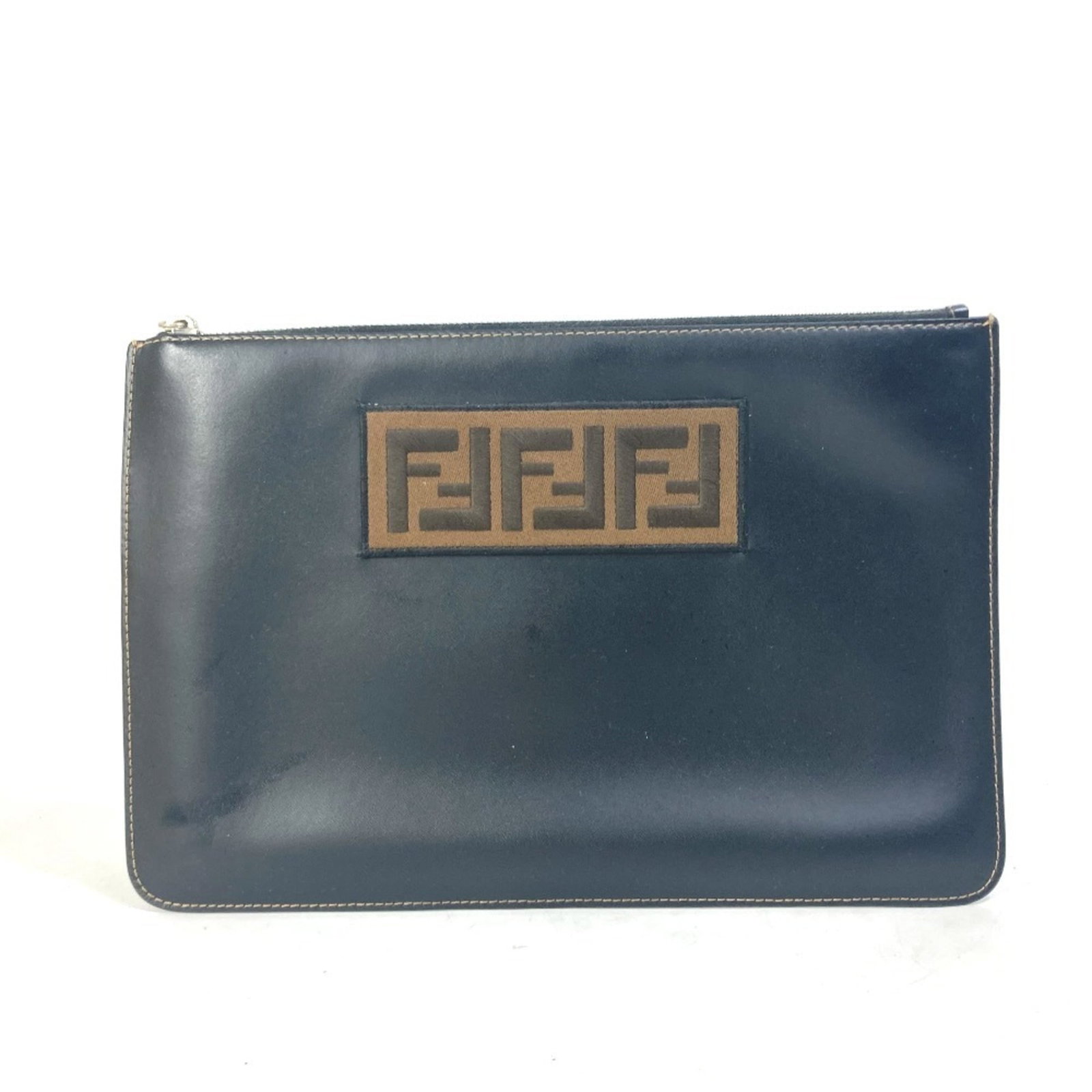 Clutch bag pouch leather Fendi: Clutch bag pouch leather Fendi Black and brown leather Fendi clutch bag pouch in excellent used condition, featuring a classic design with some minor scratches and dirt. The leather has developed a be