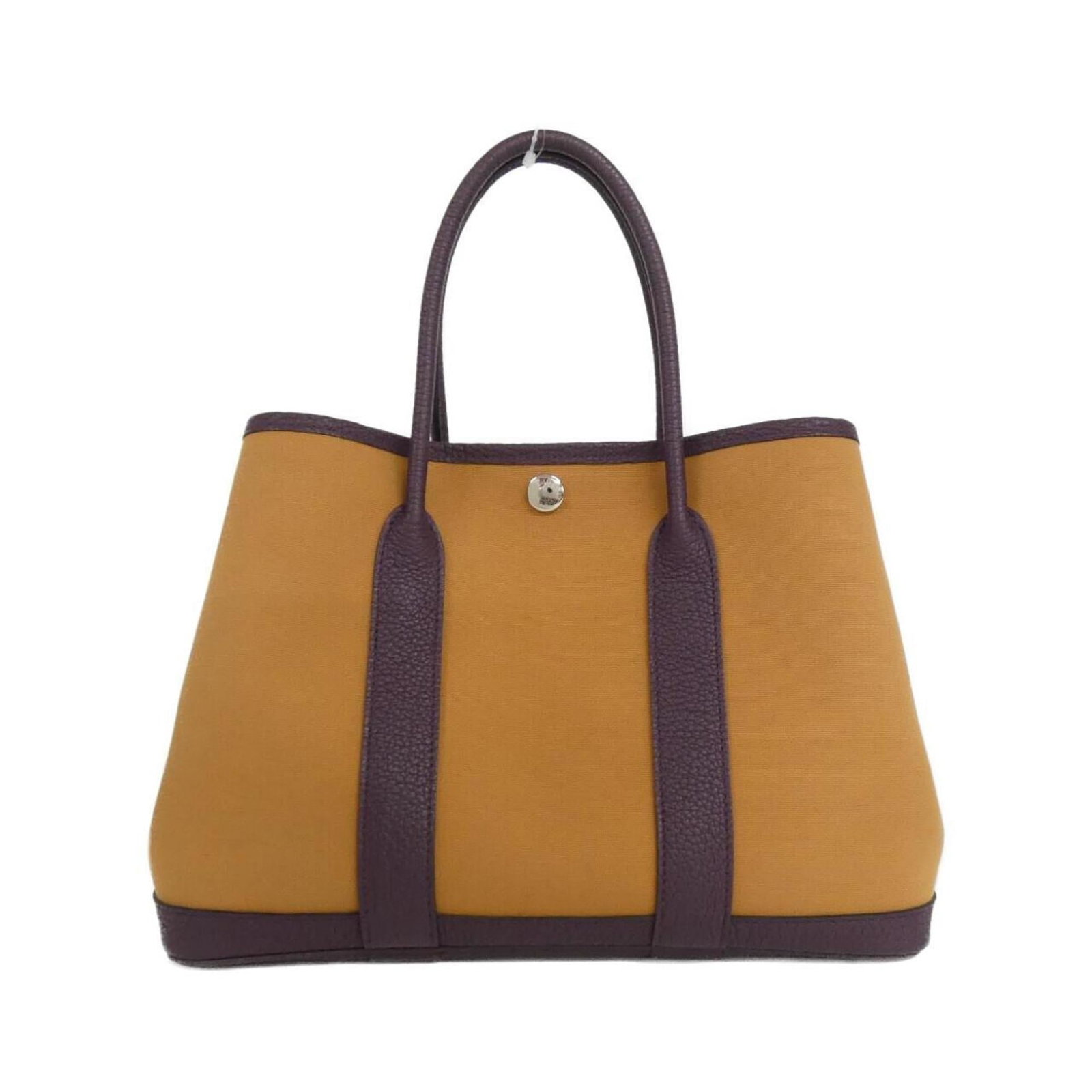 Handbag Leather Hermes Negonda Toile Officier: Handbag Leather Hermes Negonda Toile Officier Toile Officier and Negonda leather come together in this classic Hermes handbag, showcasing the iconic Cassis color. With its signature silver hardware