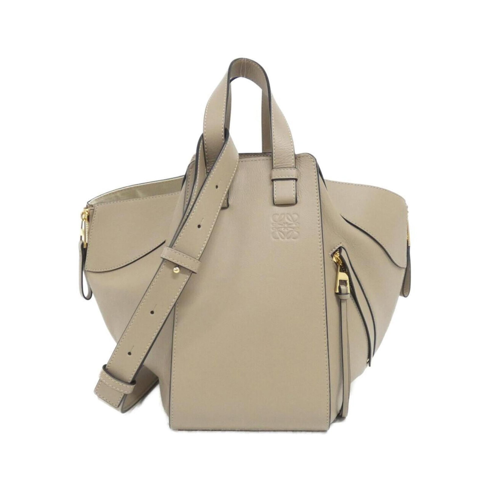 Shoulder Bag Leather by Loewe: Shoulder Bag Leather by Loewe This pre-owned Loewe shoulder bag boasts rich, supple leather made from high-quality calfskin. With its classic design and timeless beige color, it's a versatile