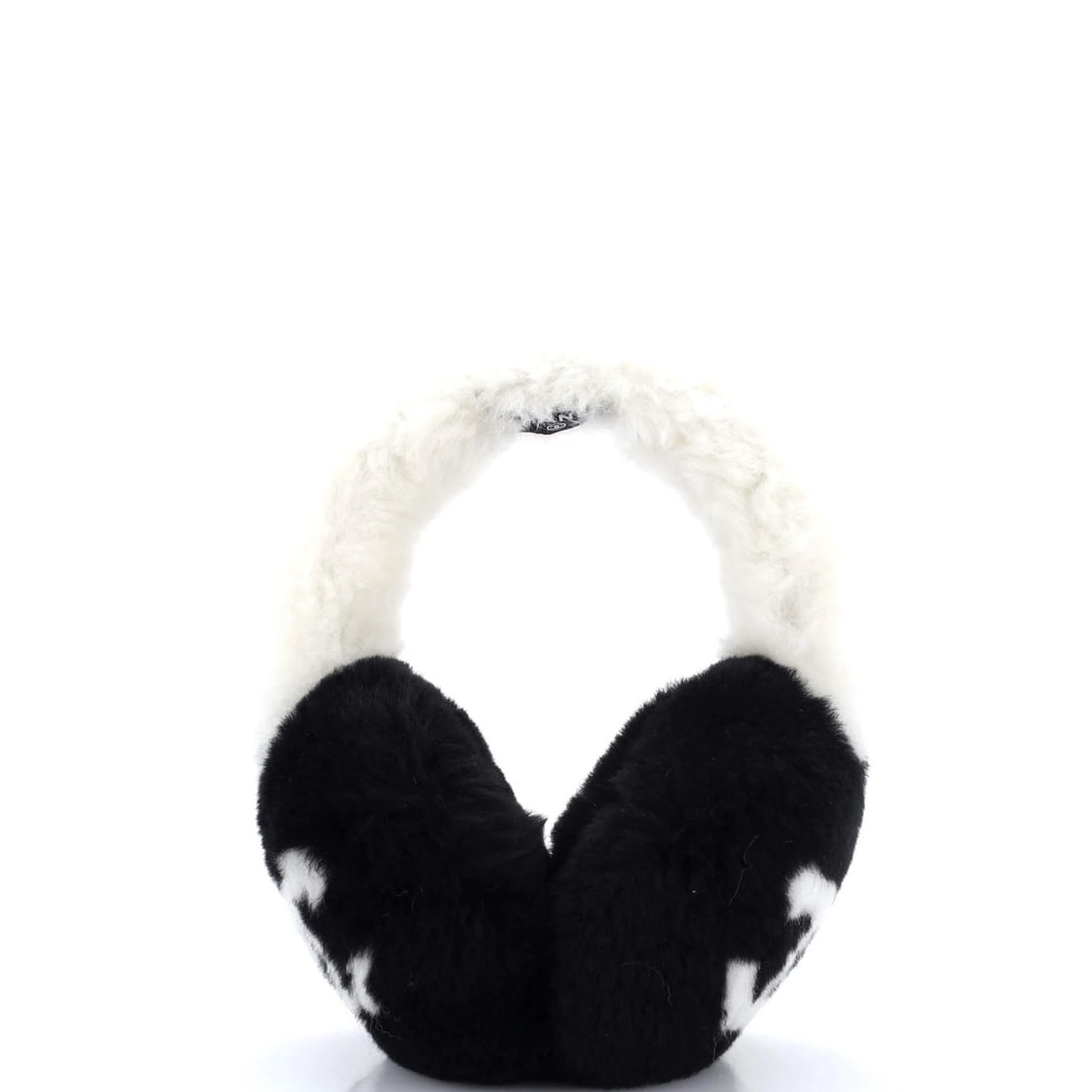 Shearling earmuffs by Chanel: Shearling earmuffs by Chanel Shearling earmuffs by Chanel feature a sleek black exterior with white accents, crafted from high-quality shearling materials. The CC Earmuffs design boasts a classic