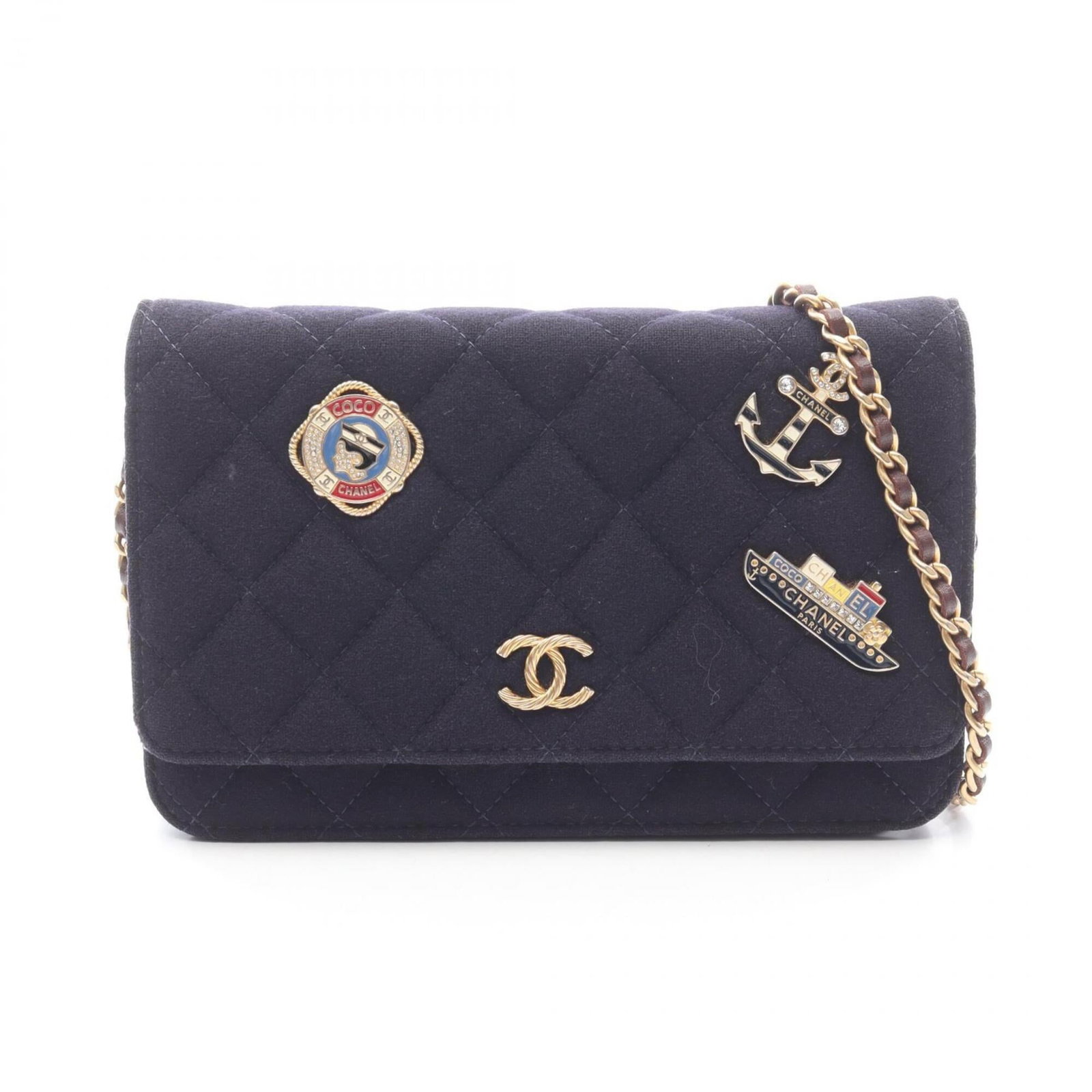 Handbag of wool leather shoulder by Chanel: Handbag of wool leather shoulder by Chanel Wool and leather shoulder bag from iconic fashion brand Chanel, featuring a classic design with brown and navy color options. This pre-owned handbag has